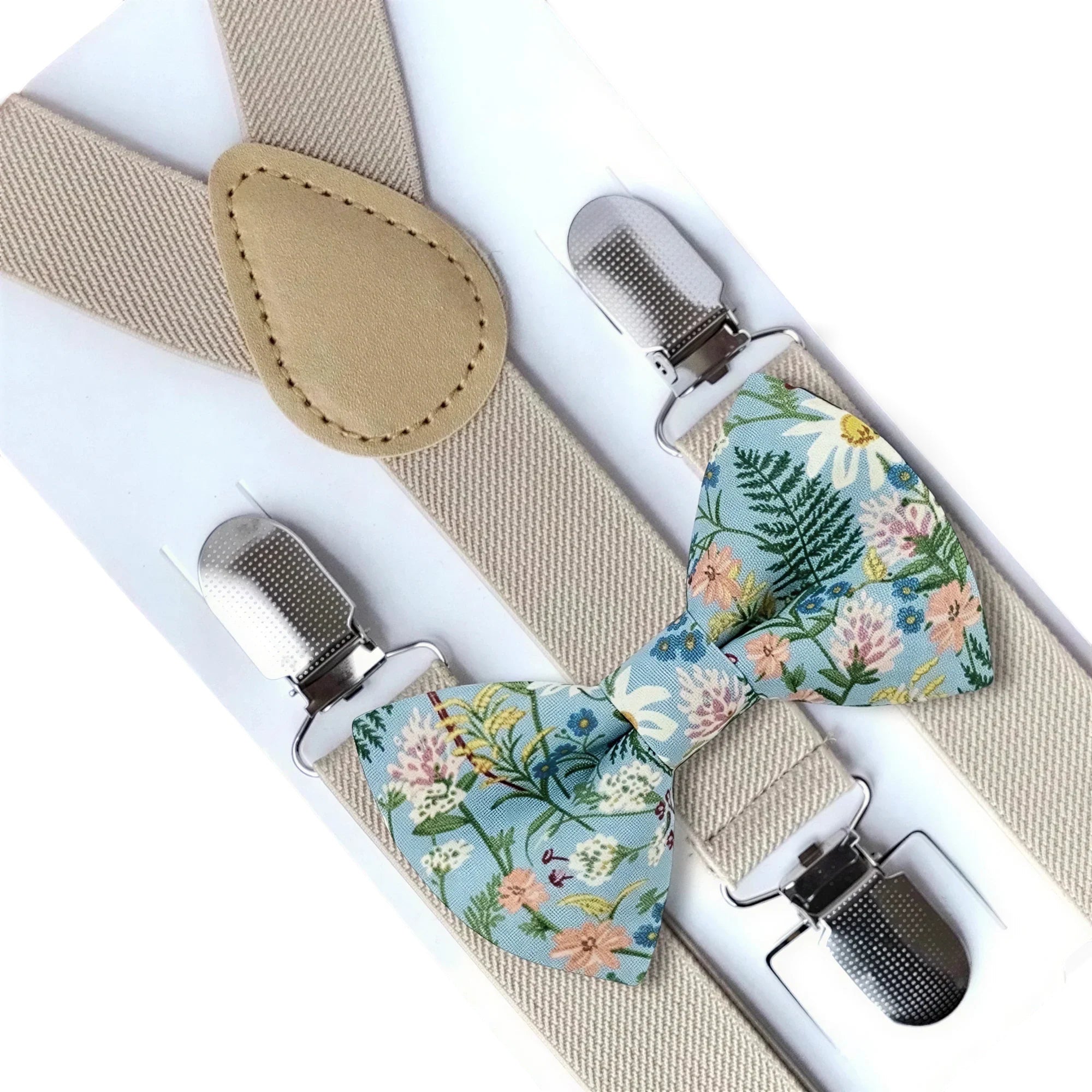 The Bold Bow Tie dusty blue wildflower cotton bow tie paired with adjustable tan elastic Y-back suspenders.