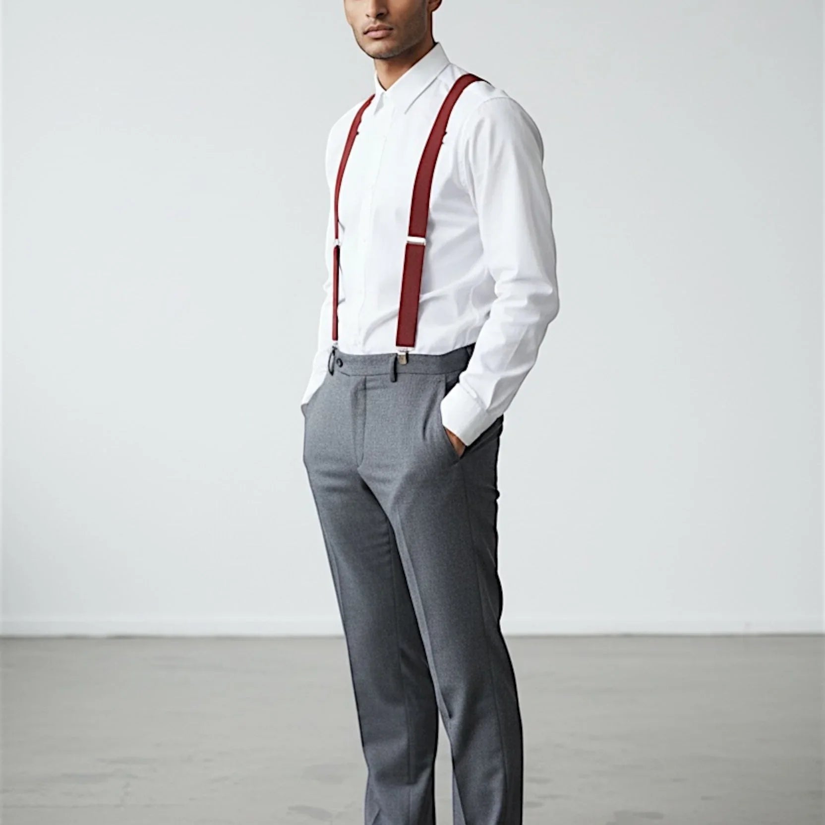 Mens burnt orange suspenders for men on groomsman in a white shirt and gray pants for a wedding.