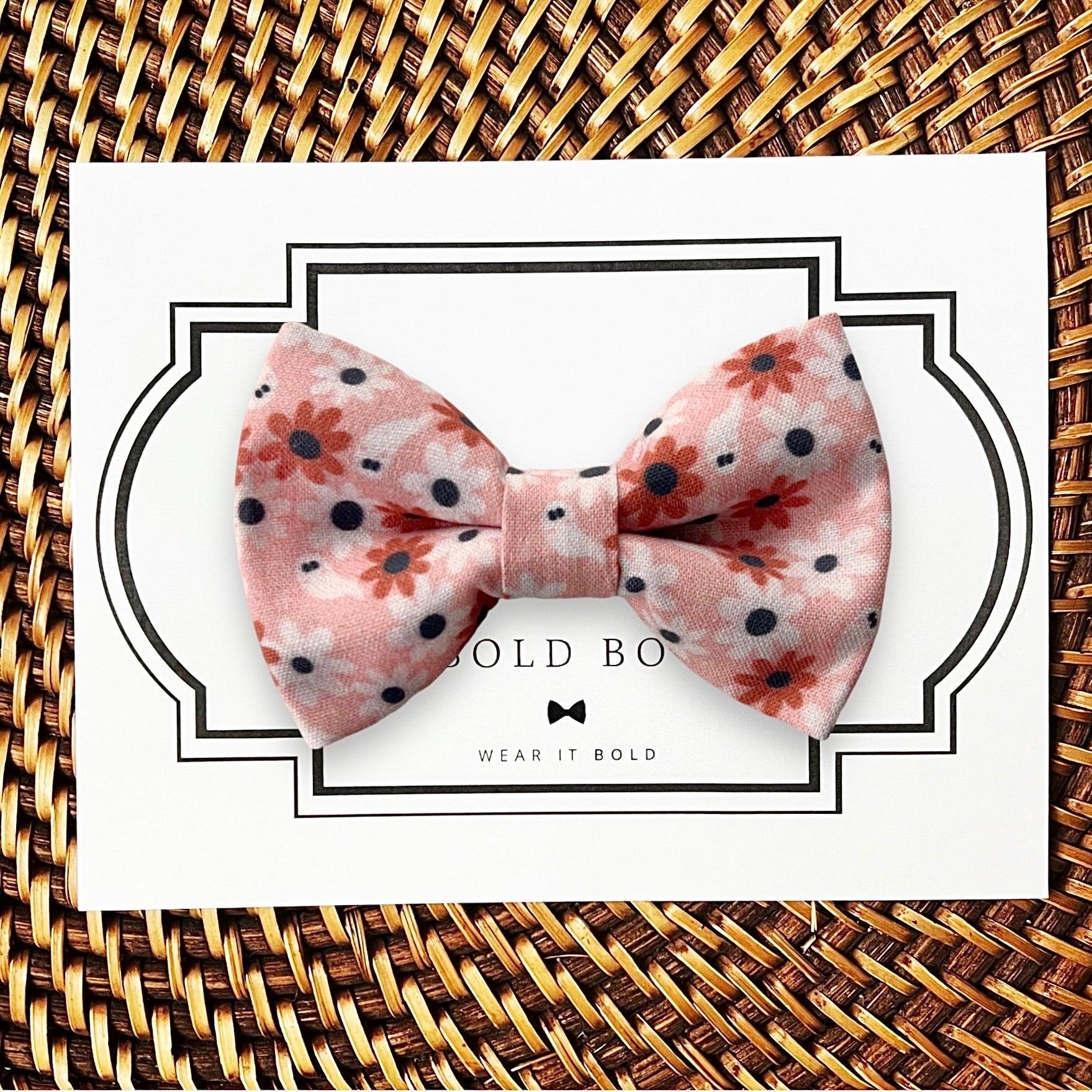 Dog bow tie size chart. Size Small is 3 1/2 inches wide for small dogs under 15 lbs. Size Medium is 4 inches wide for medium dogs between 15 band 40 lbs. Size Large is 4 1/2 inches wide for Large Dogs between 40 band 80 lbs. Size Extra Large is 5 1/2 inches wide for Extra Large Dogs over 80 lbs. Sizing is up to preference and pet bow ties slide on to dog collars with elastic.