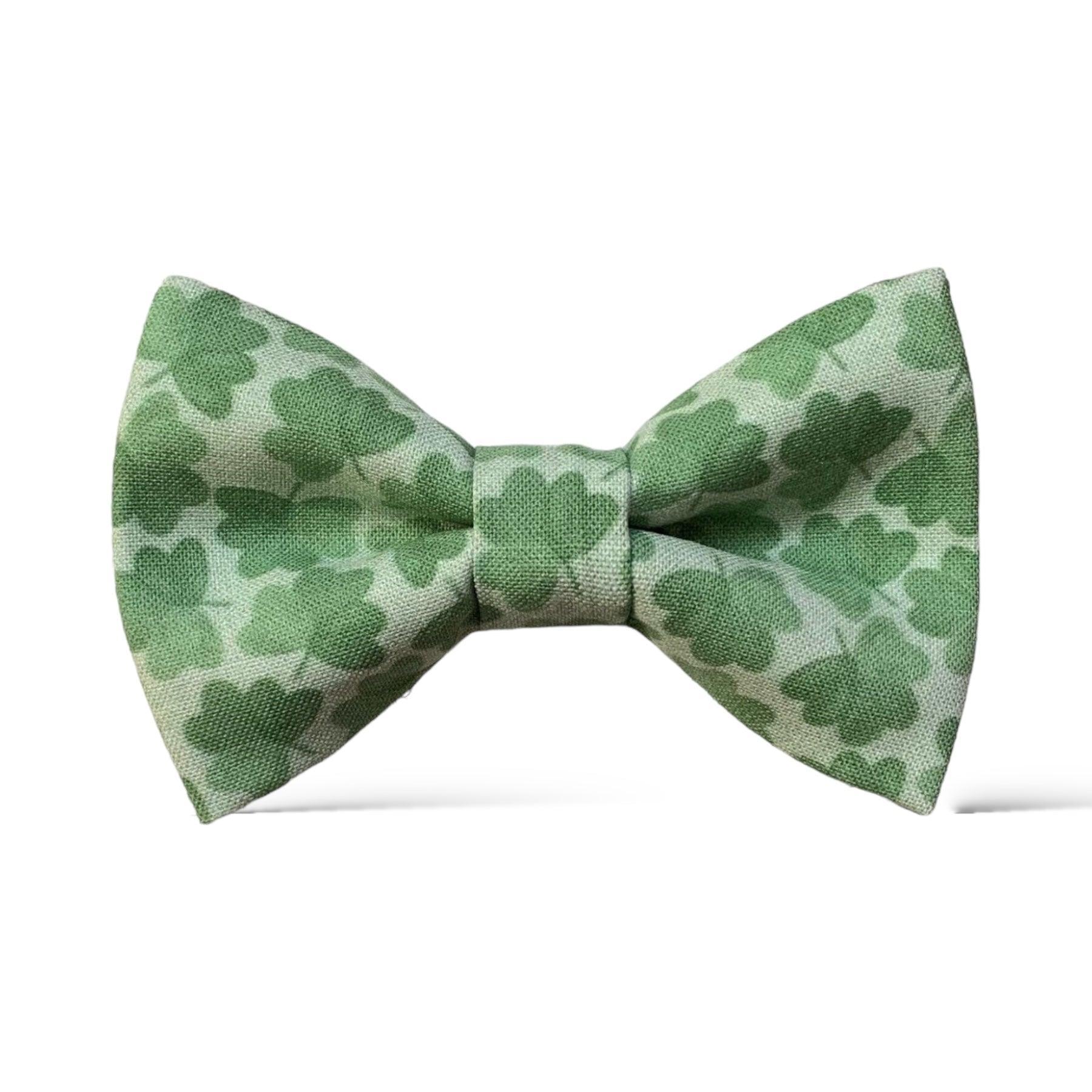Size chart for pre-tied bow ties from The Bold Bow Tie detailing measurements across three sizes. Small is 3.5 inches wide and recommended for ages 6 months to 5 years. Medium is 4 inches wide and recommended for ages 6 to 12 years. Large is 4.5 inches wide and recommended for ages 13 years and up. Visual icons illustrate the relative sizes with horizontal arrows showing that width is measured from wingtip to wingtip. Bottom text notes that all bow ties are pre-tied and ready to add to your outfit.