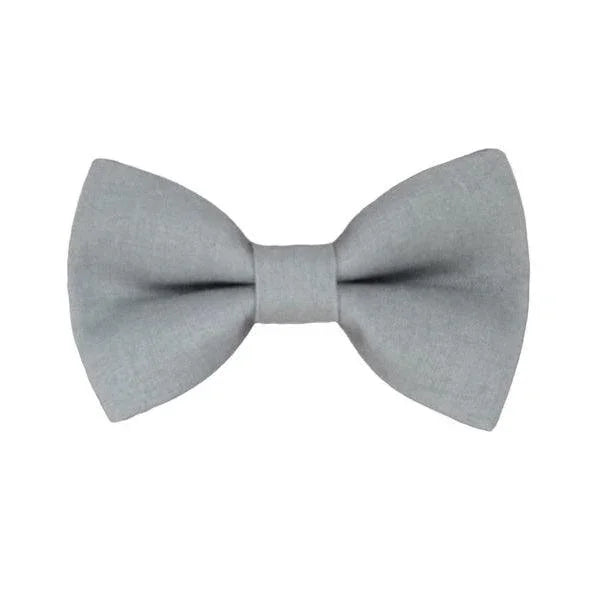 Size chart for pre-tied bow ties from The Bold Bow Tie detailing measurements across three sizes. Small is 3.5 inches wide and recommended for ages 6 months to 5 years. Medium is 4 inches wide and recommended for ages 6 to 12 years. Large is 4.5 inches wide and recommended for ages 13 years and up. Visual icons illustrate the relative sizes with horizontal arrows showing that width is measured from wingtip to wingtip. Bottom text notes that all bow ties are pre-tied and ready to add to your outfit.
