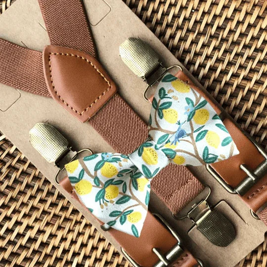 Lemon Grove Rifle Paper Co bow tie with a lemon print paired with cognac buckle suspenders and brown leather details