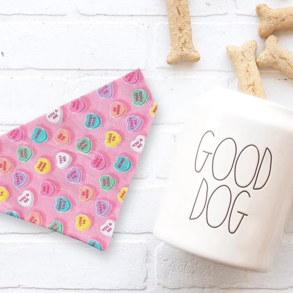 a cup of coffee next to some dog treats