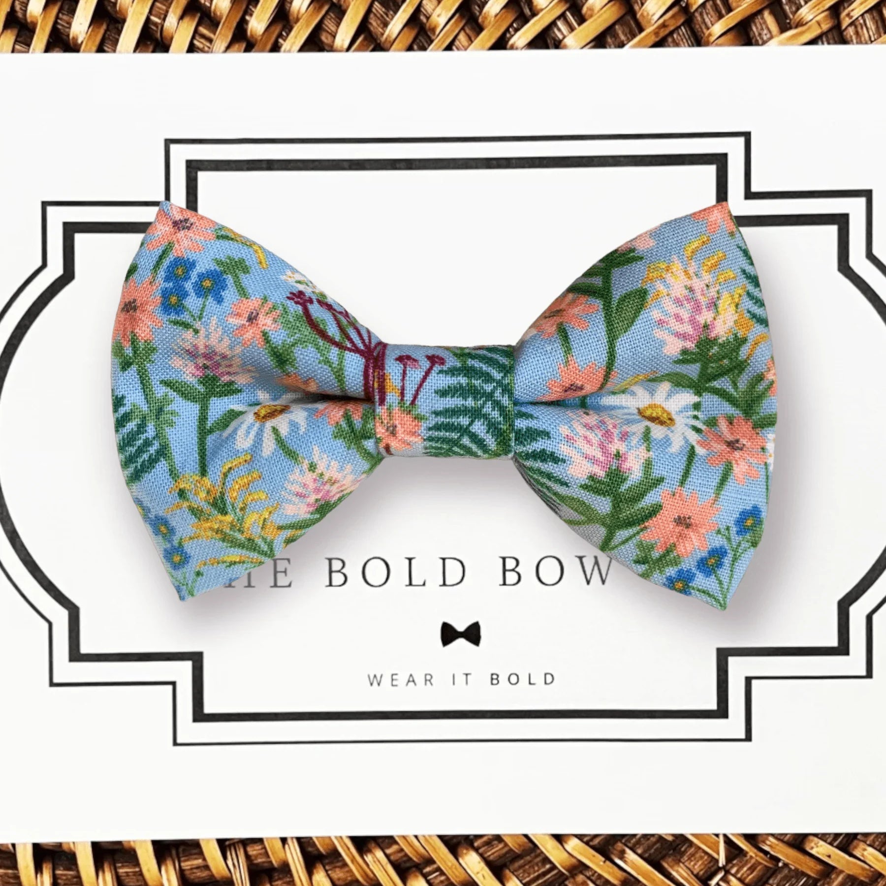 Floral blue bow tie with pink and white flowers on a white display card for the Floral Spring Bow Tie Gift Set