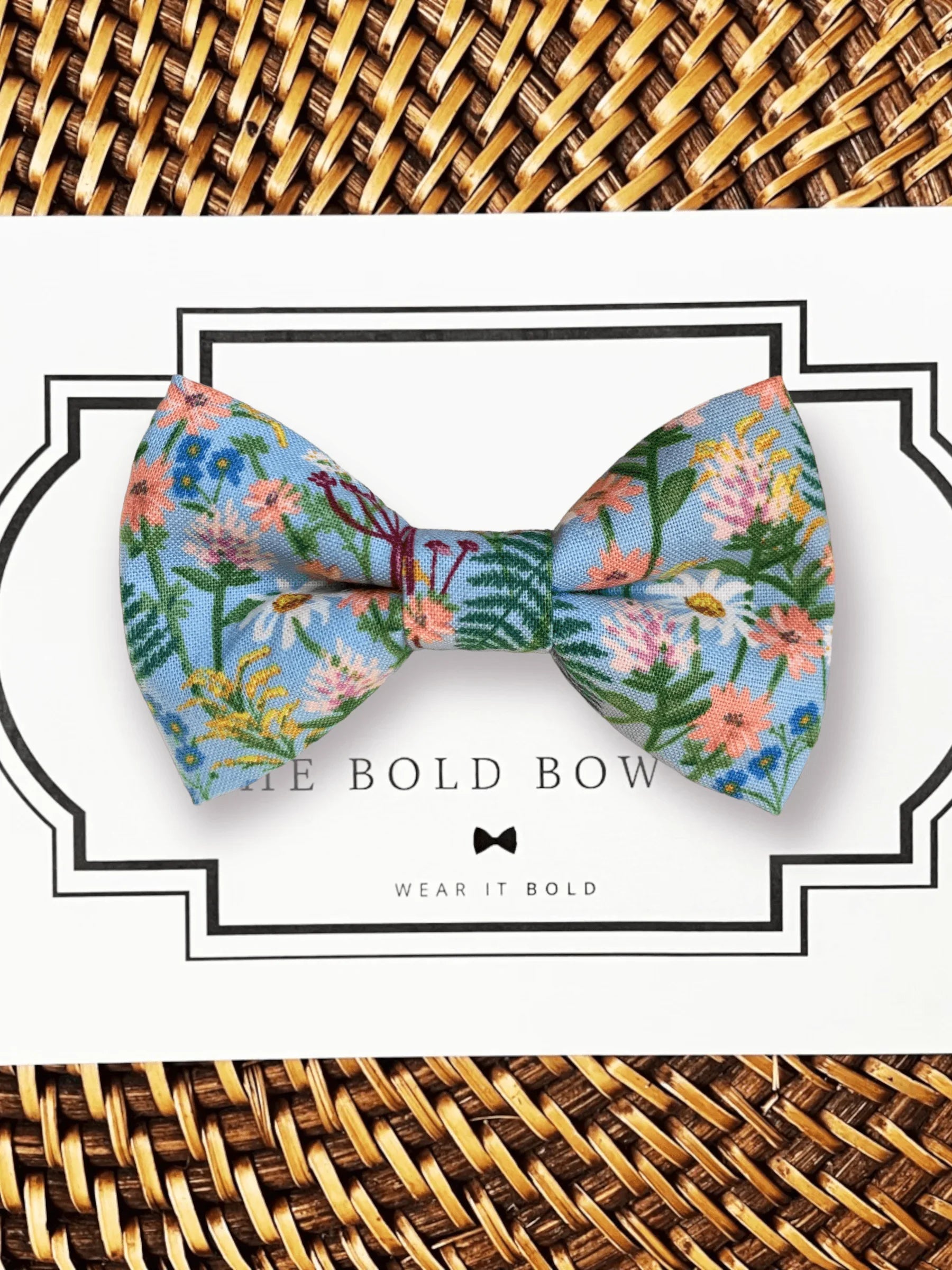 Floral blue bow tie with pink and white flowers on a white display card for the Floral Spring Bow Tie Gift Set