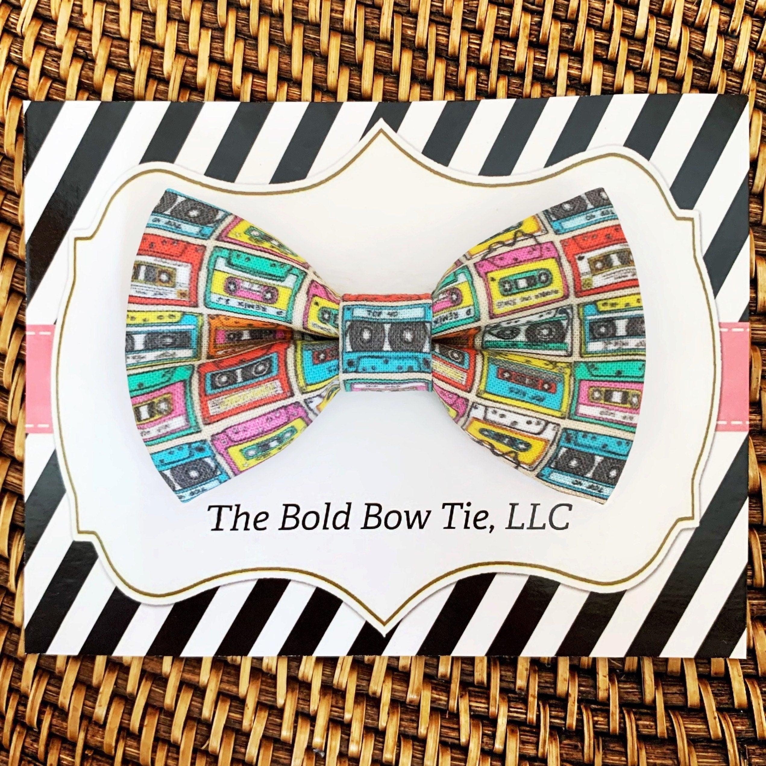 Cassette tape pattern bow tie on a white card with bold black diagonal stripes from The Bold Bow Tie gift set