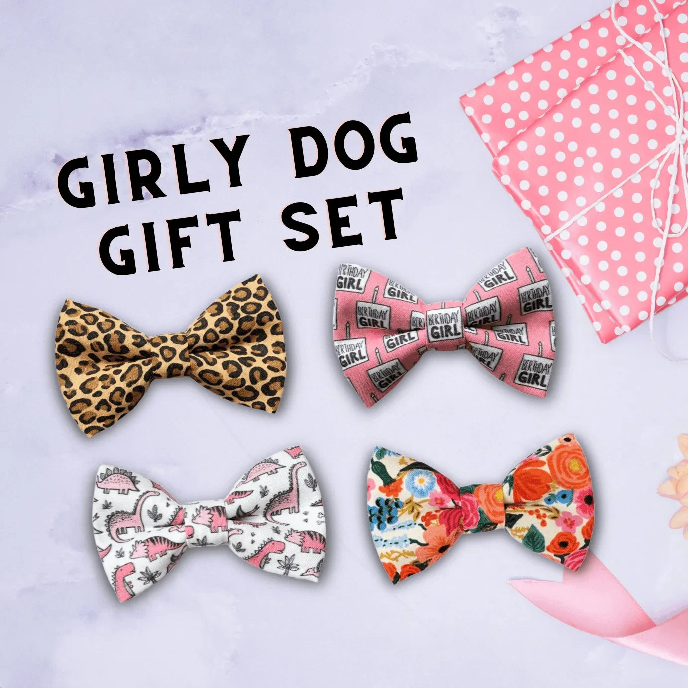Assorted girly dog and cat bows arranged on a lavender background with a pink polka dot gift box