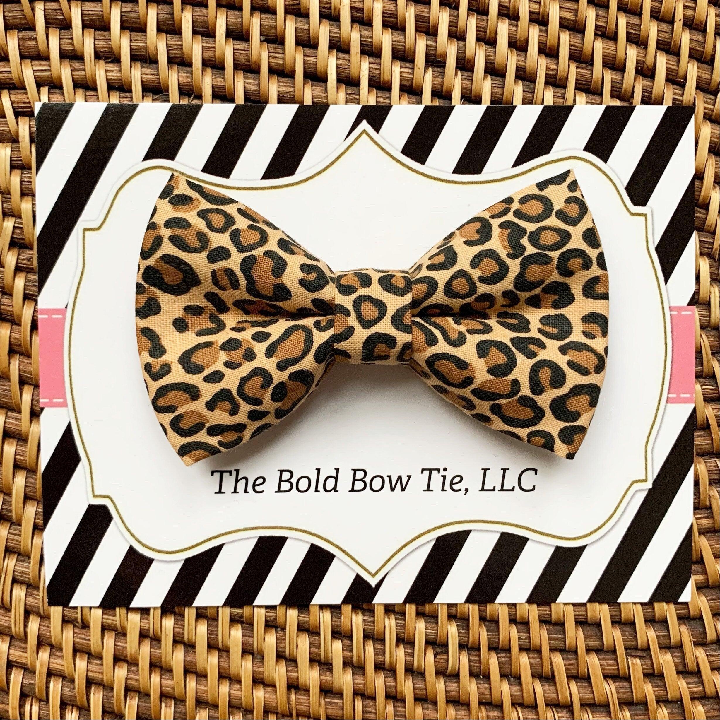 Leopard print bow on a white card with bold black diagonal stripe packaging from The Bold Bow Tie LLC