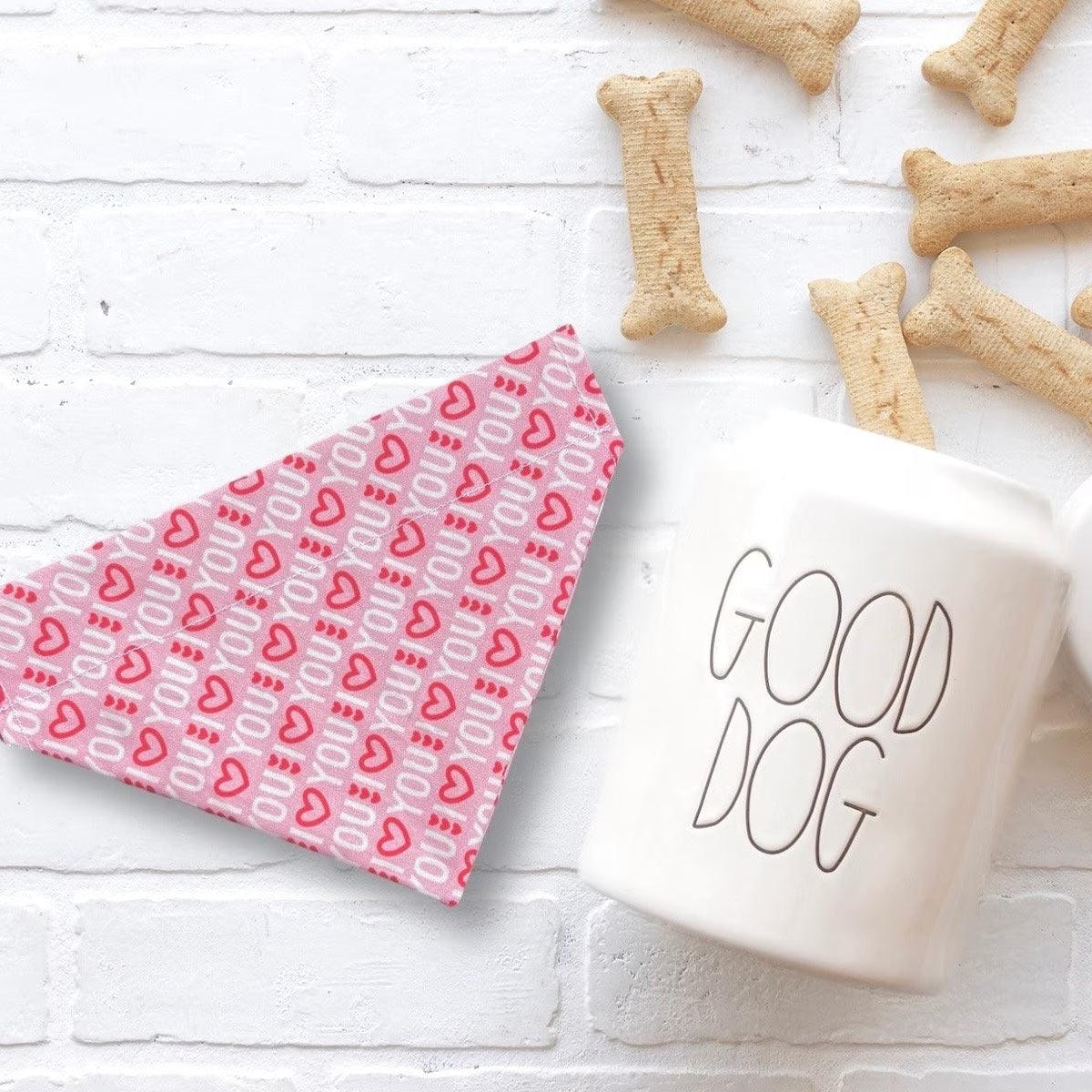 a cup of coffee next to some dog bones