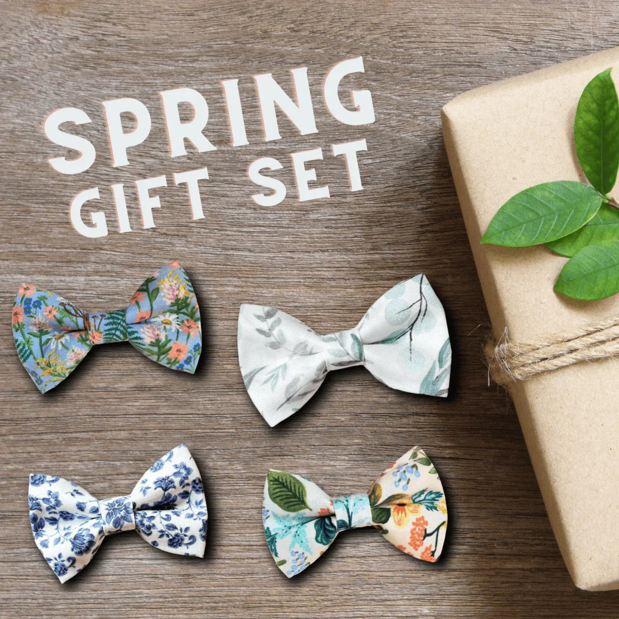 Spring gift set of floral bow ties for dogs or cats displayed on wood with a wrapped gift box