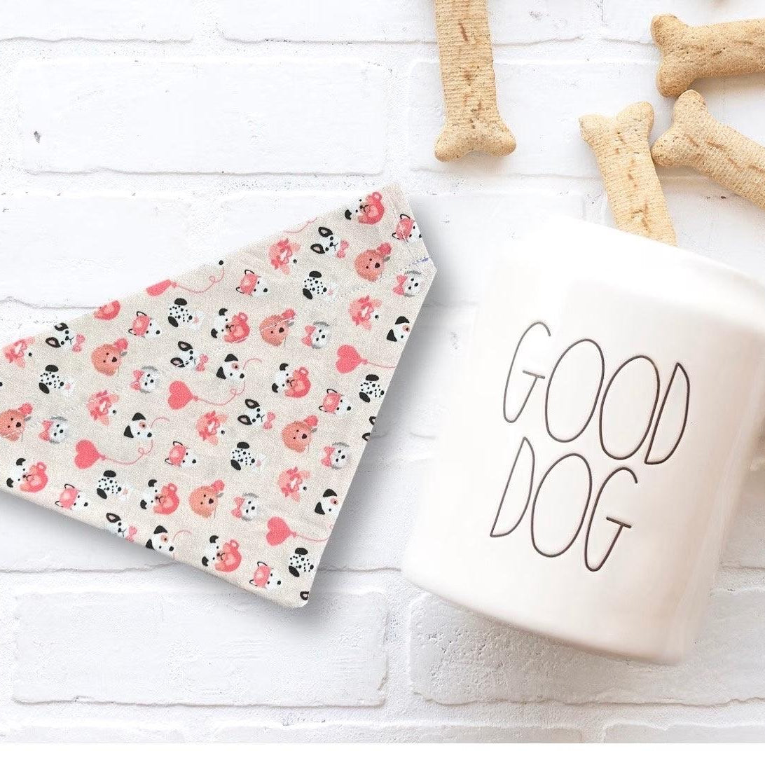 a cup of coffee next to some dog treats