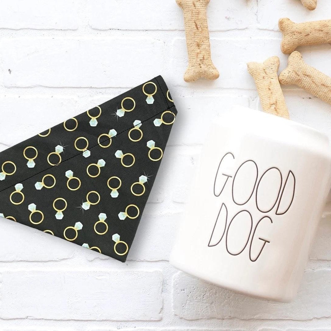 a cup of coffee next to some dog treats