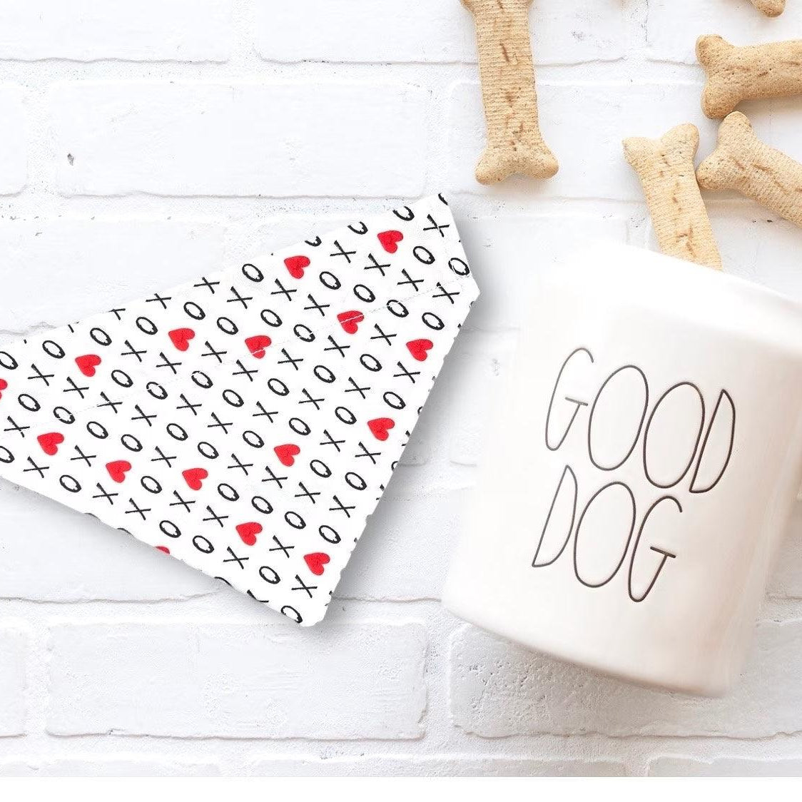 a cup of coffee next to some dog treats