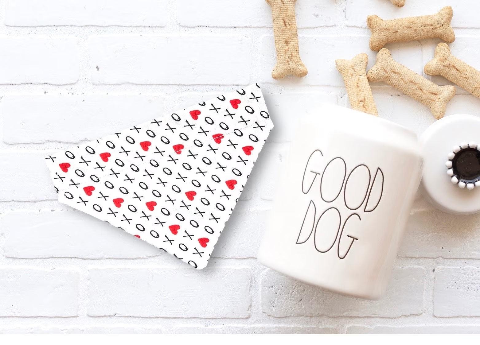 a cup of coffee next to some dog treats