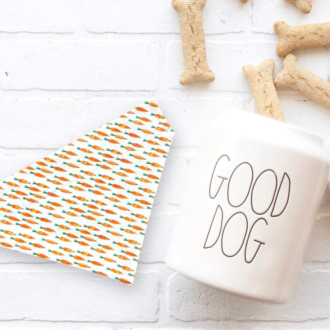 An Easter dog bandana next to some dog bones