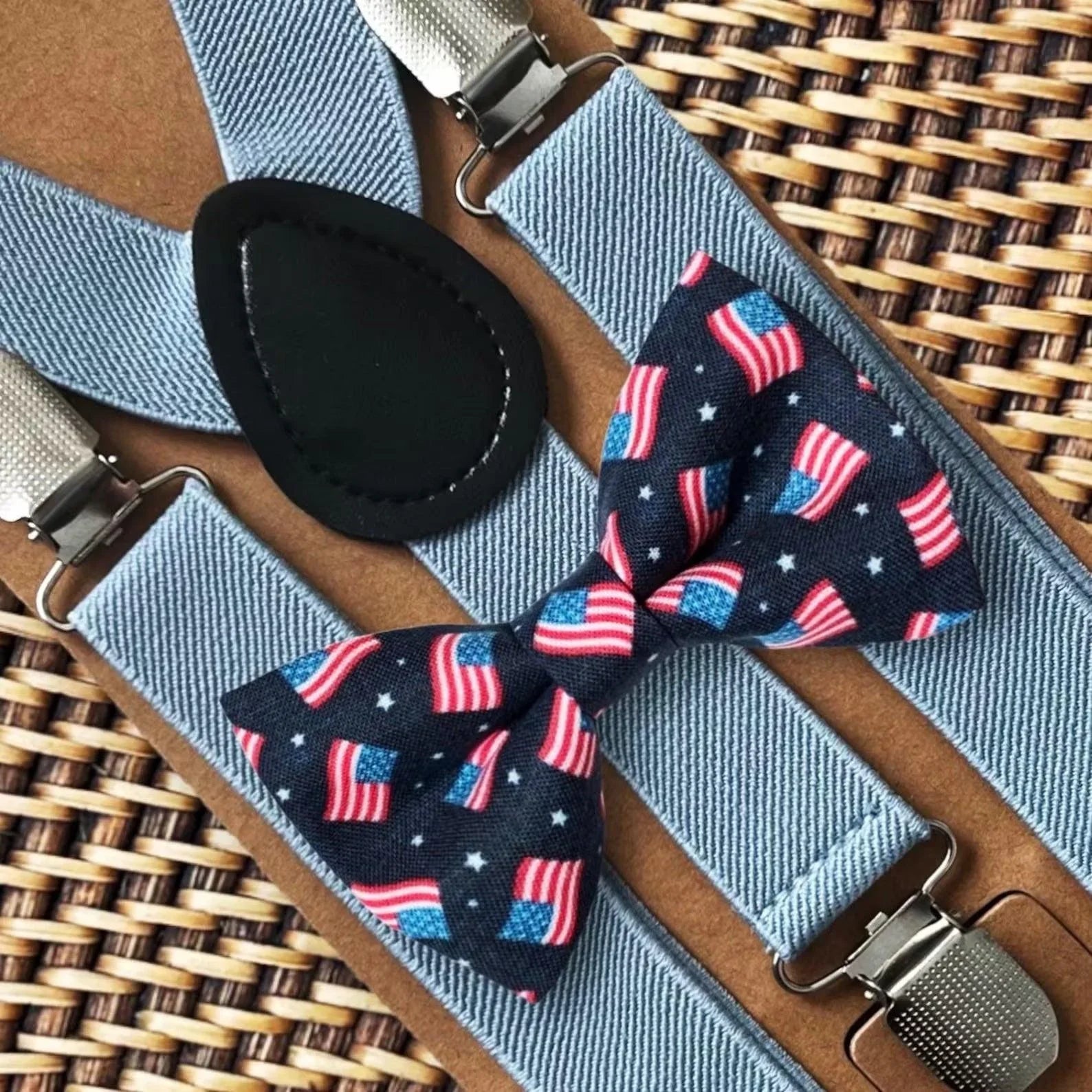 The Bold Bow Tie size chart for bow tie and suspender sets showing Small, Medium, Adult, and Big & Tall sizes with typical age ranges, suspender lengths, and bow tie widths. Small fits ages 6 months–6 years with 18–29 inch suspenders and a 3.5 inch bow tie; Medium fits ages 7–12 years with 25.5–40 inch suspenders and a 4 inch bow tie; Adult fits ages 13 years–6 feet tall with 25.5–40 inch suspenders and a 4.5 inch bow tie; Big & Tall fits over 6 feet tall with 31–53 inch suspenders and a 4.5 inch bow tie.