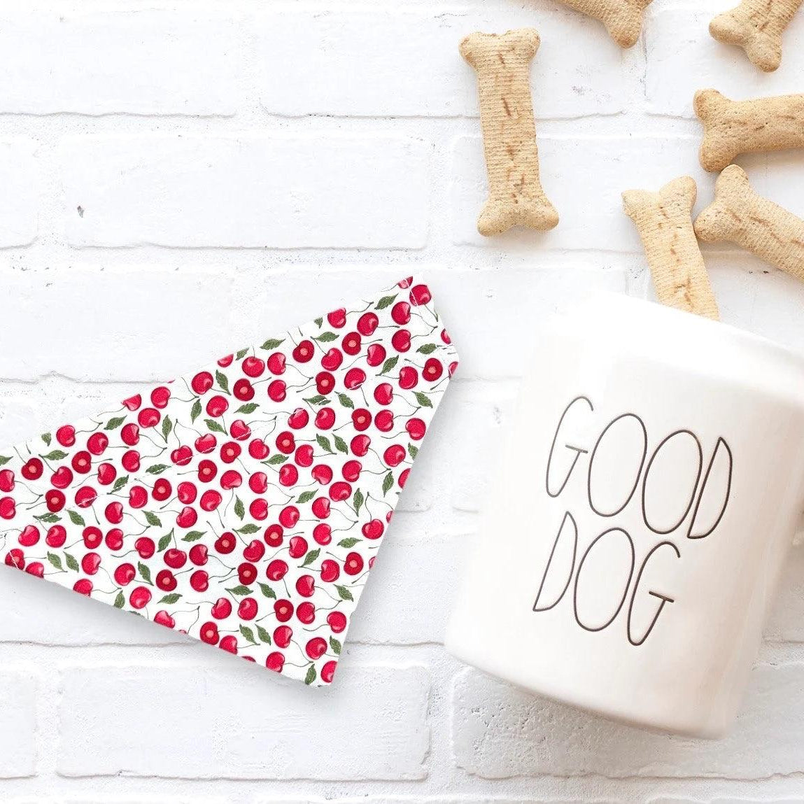 a cup of coffee next to a dog treat