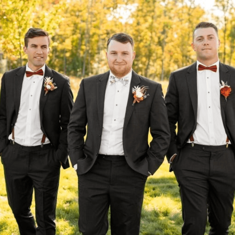 Groomsmen in burnt orange floral bow tie.