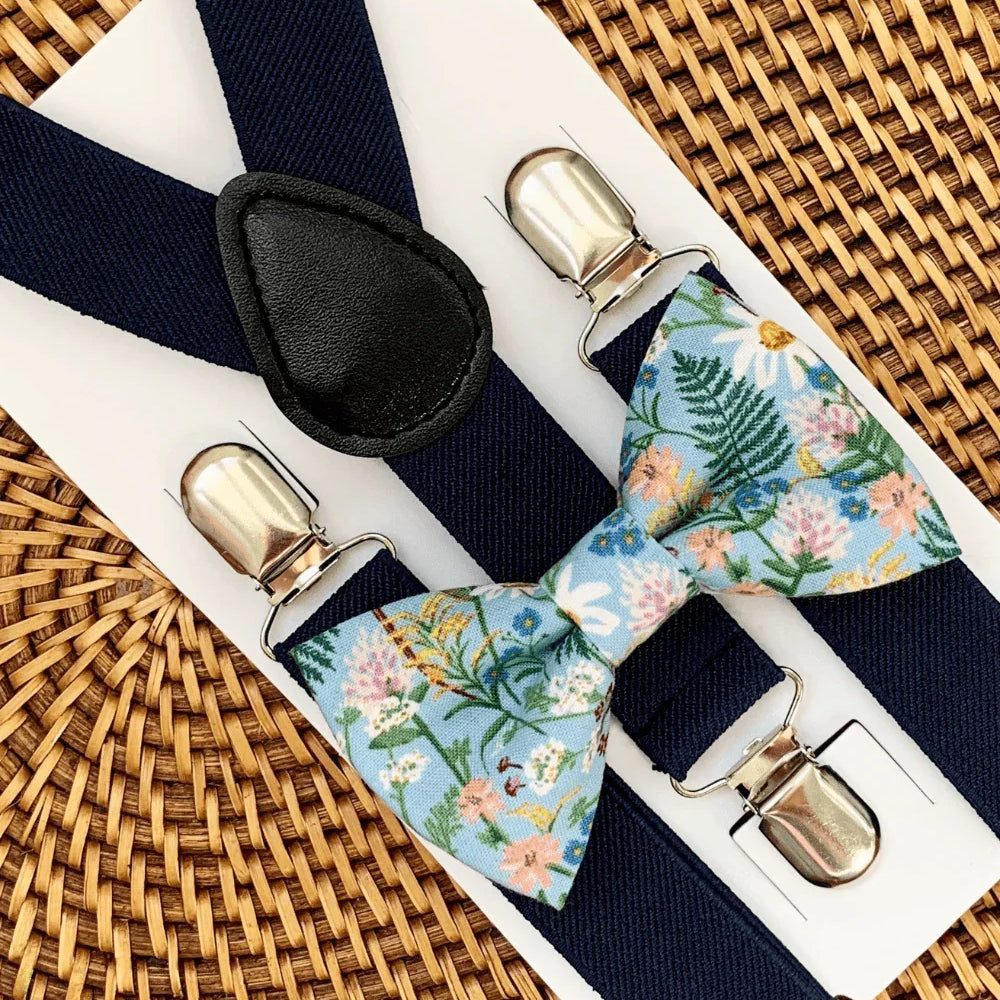 Size chart for suspender and bow tie sets from The Bold Bow Tie. Small (6mo-6yr): 18"-29" suspenders, 3.5" bow. Medium (7-12yr): 25.5"-40" suspenders, 4" bow. Adult (13yr-6ft tall): 25.5"-40" suspenders, 4.5" bow. Big & Tall (Over 6ft tall): 31"-53" suspenders, 4.5" bow. Instructions note to measure from the back waistband over the shoulder to the front waistband for a comfortable fit.