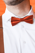 Rust Bow Tie displayed on a groomsmen in a wedding.