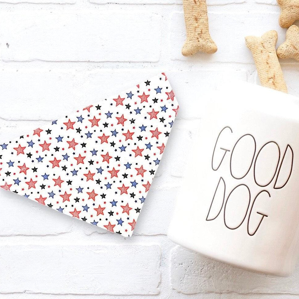 a cup of coffee next to some dog treats