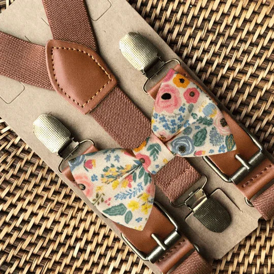 Size chart for suspender and bow tie sets from The Bold Bow Tie. X-Small (6mo-4yr): 15"-23" suspenders, 3.5" bow. Small (5-9yr): 18"-33" suspenders, 3.5" bow. Medium (10-12yr): 18"-33" suspenders, 4" bow. Adult (13yr-6'5"): 30"-53" suspenders, 4.5" bow. Big & Tall (Over 6'5"): 53"+ suspenders, 4.5" bow. Instructions note to measure from the back waistband over the shoulder to the front waistband for a comfortable fit.
