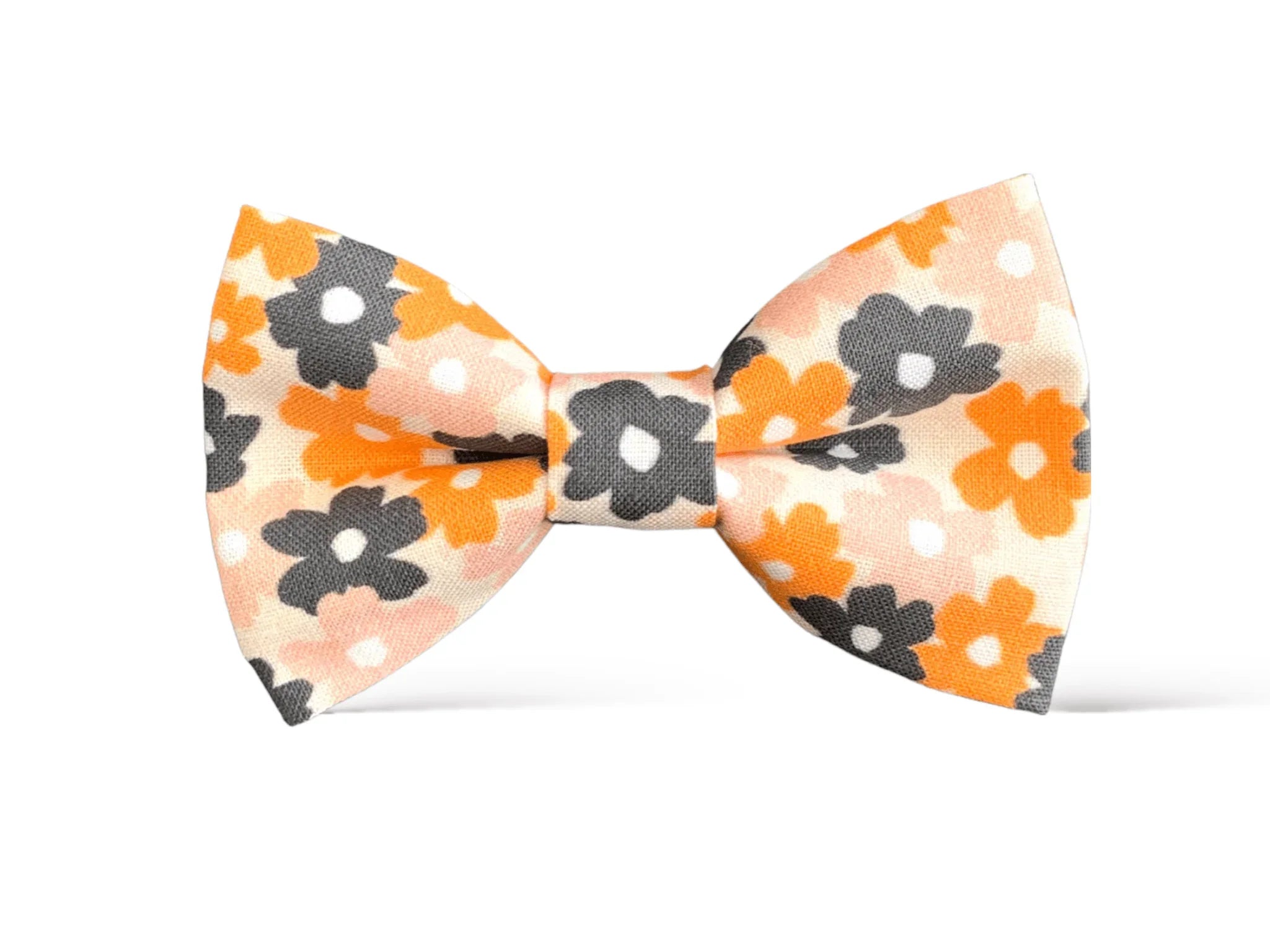 Size chart for pre-tied bow ties from The Bold Bow Tie detailing measurements across three sizes. Small is 3.5 inches wide and recommended for ages 6 months to 5 years. Medium is 4 inches wide and recommended for ages 6 to 12 years. Large is 4.5 inches wide and recommended for ages 13 years and up. Visual icons illustrate the relative sizes with horizontal arrows showing that width is measured from wingtip to wingtip. Bottom text notes that all bow ties are pre-tied and ready to add to your outfit.