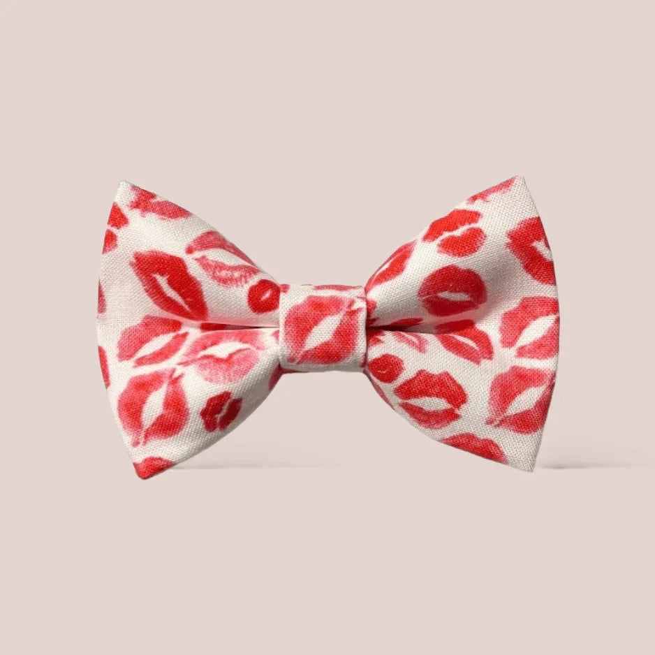 Lipstick Kisses Hair Bow fabric white with red lip prints on pale pink background
