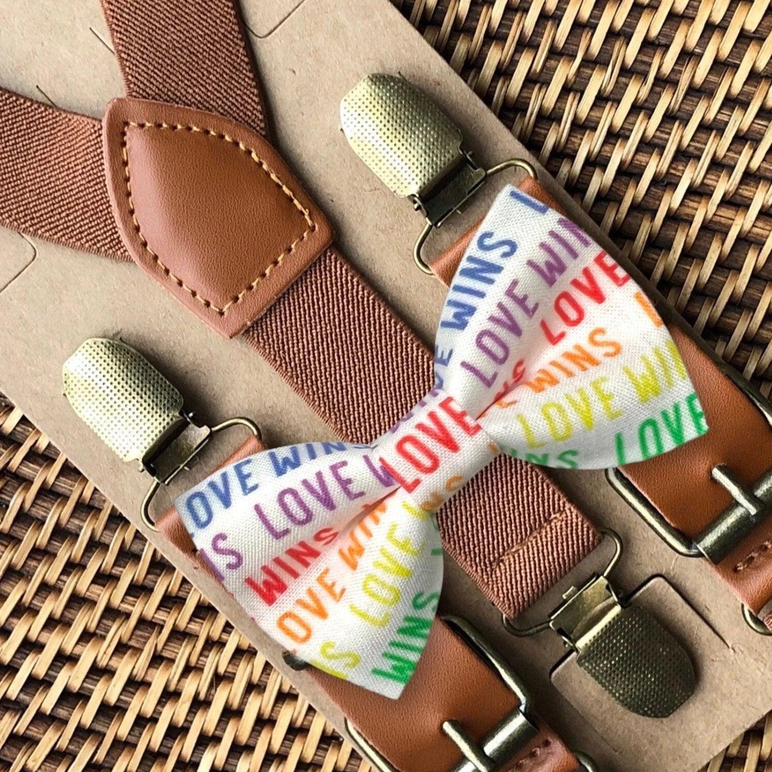 Rainbow Love Wins bow tie with cognac leather buckle suspenders and metal hardware