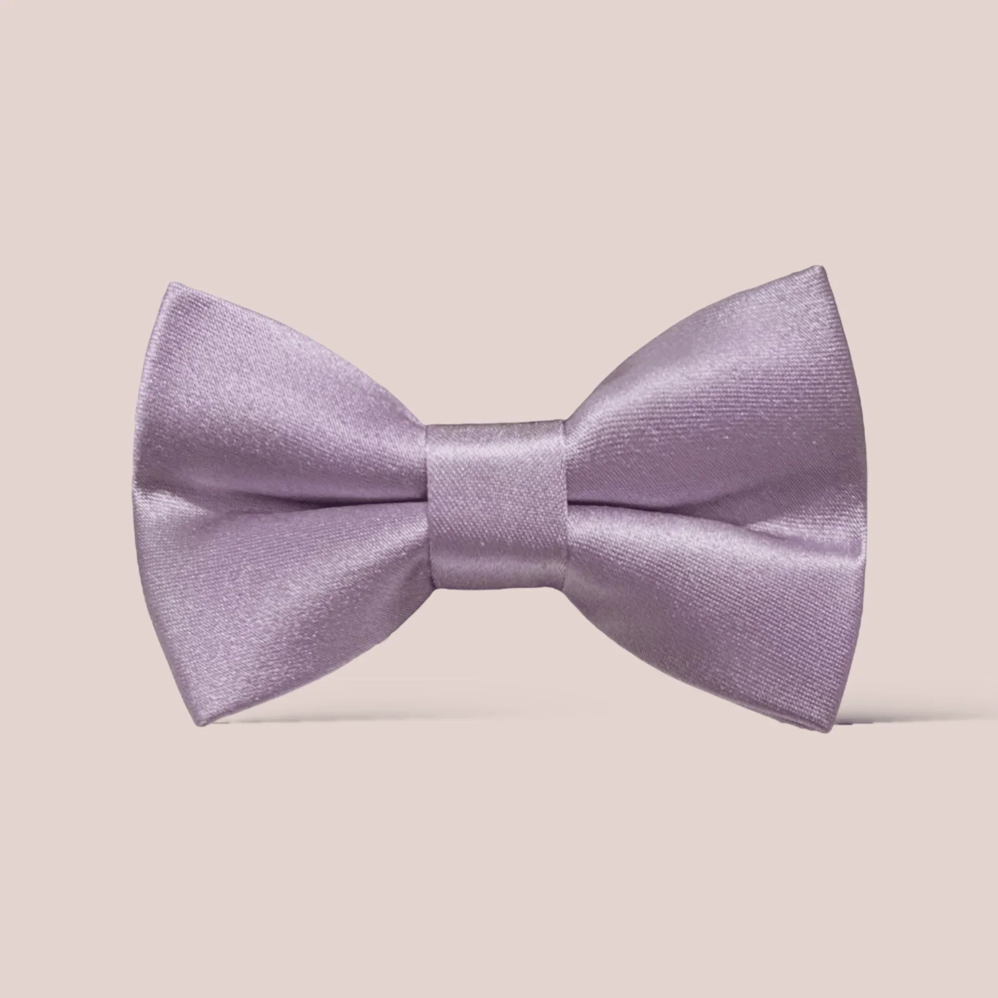 Promotional graphic from The Bold Bow Tie titled Let's Connect. On the left, a model with wavy blonde hair wears a white hair bow with a blue floral pattern. Circular text reads Handmade, 5-Star Rated, Premiere Customer Service. On the right, an Instagram icon prompts to follow @theboldbowtie and message for a coupon code. Below, an email icon encourages signing up for the VIP email list for the latest news and exclusive discounts, noting that the link to join is in the description.