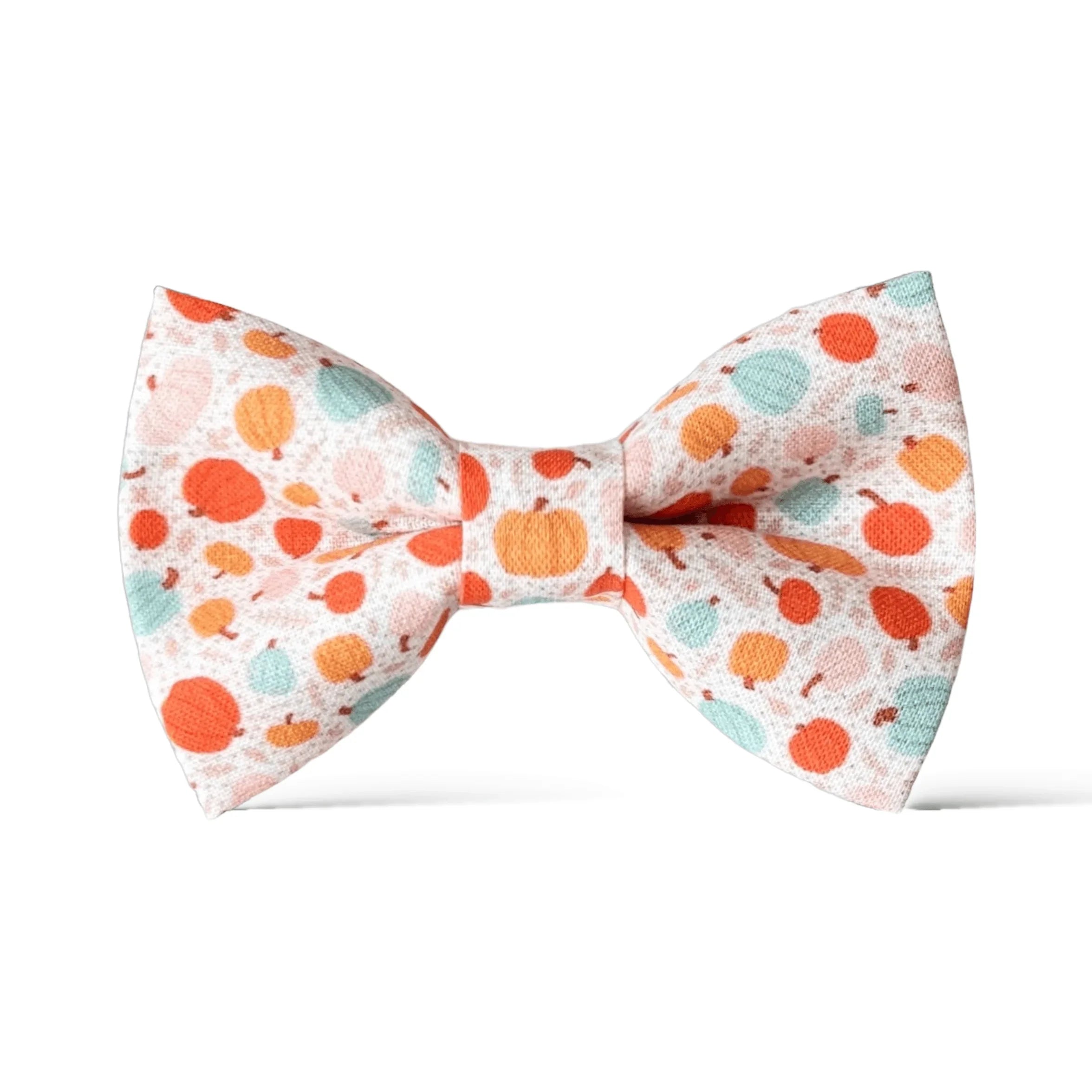 Size chart for pre-tied bow ties from The Bold Bow Tie detailing measurements across three sizes. Small is 3.5 inches wide and recommended for ages 6 months to 5 years. Medium is 4 inches wide and recommended for ages 6 to 12 years. Large is 4.5 inches wide and recommended for ages 13 years and up. Visual icons illustrate the relative sizes with horizontal arrows showing that width is measured from wingtip to wingtip. Bottom text notes that all bow ties are pre-tied and ready to add to your outfit.