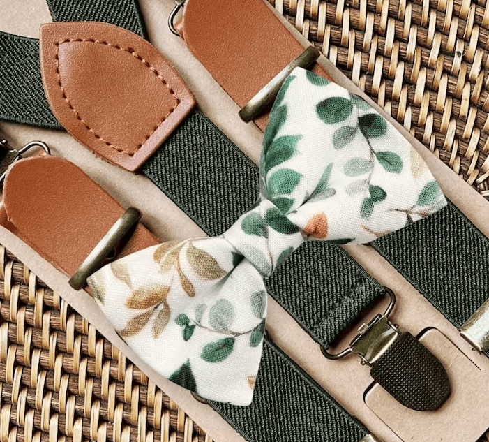 a close up of a sage green bow tie and olive green suspenders