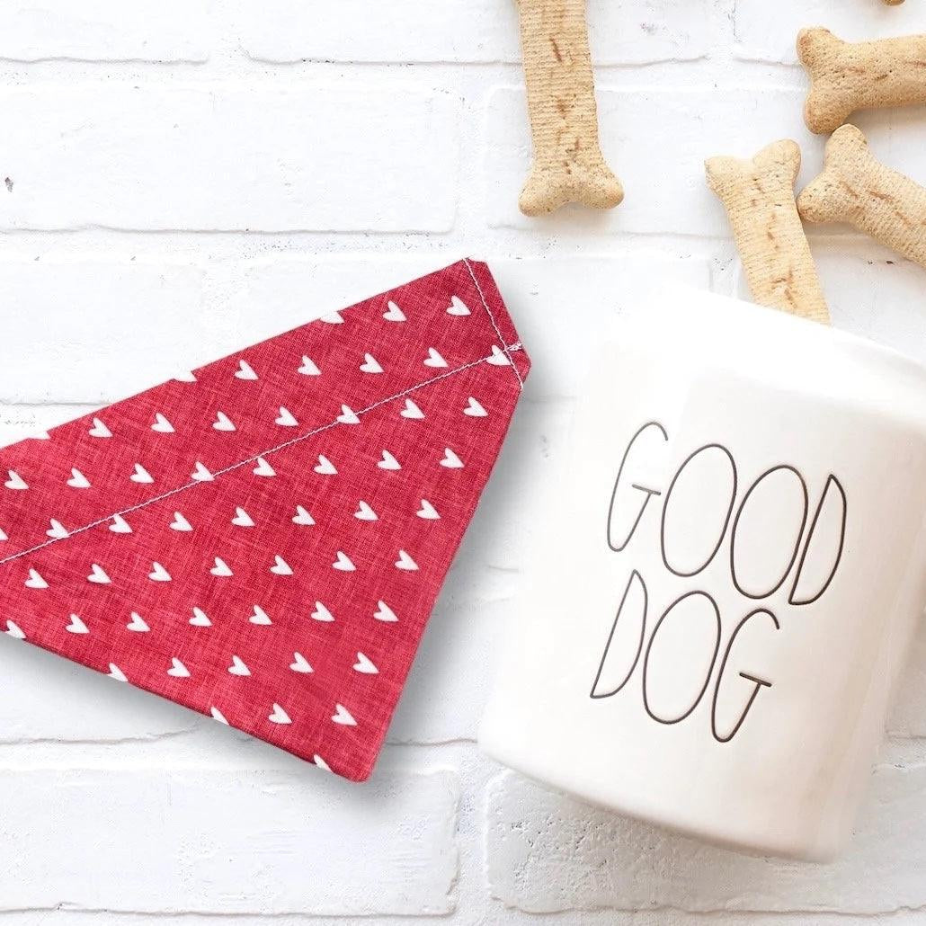 a cup of coffee next to some dog treats