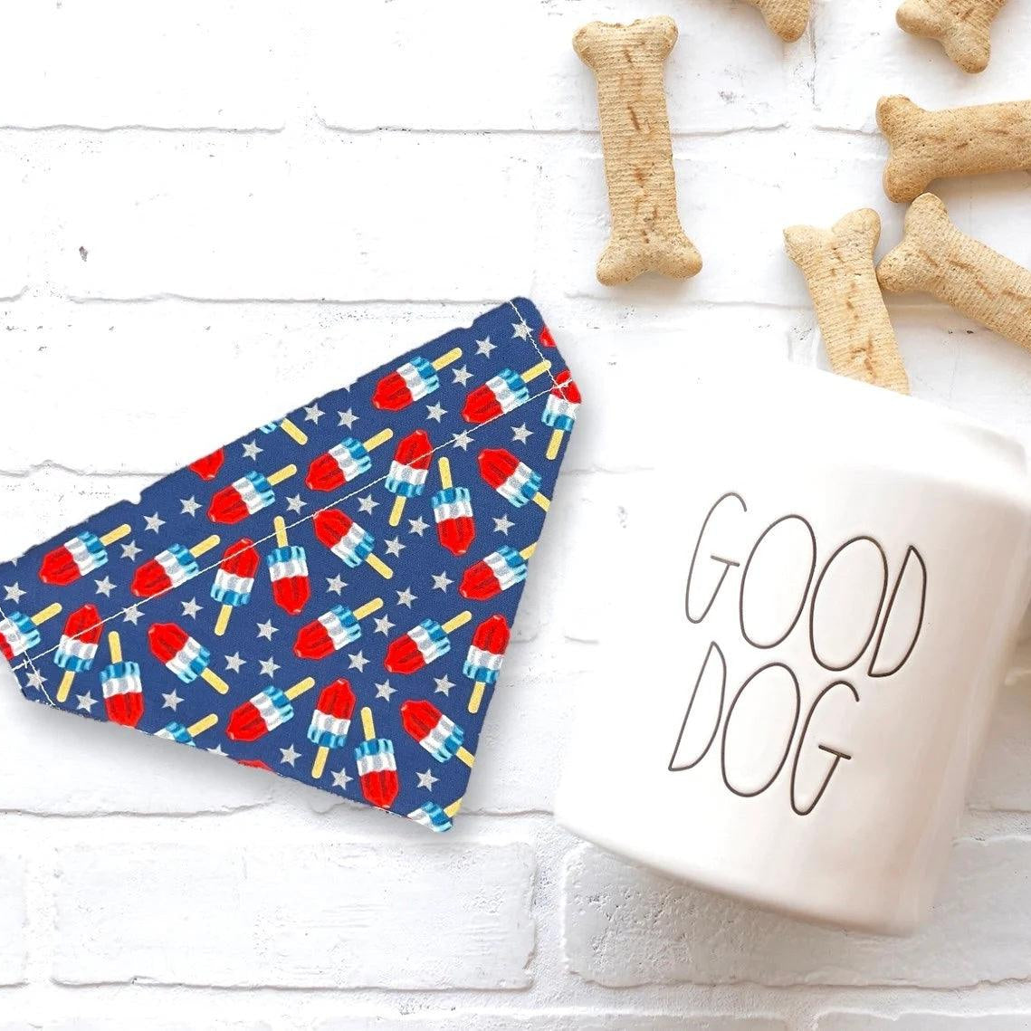 a cup of coffee next to some dog treats