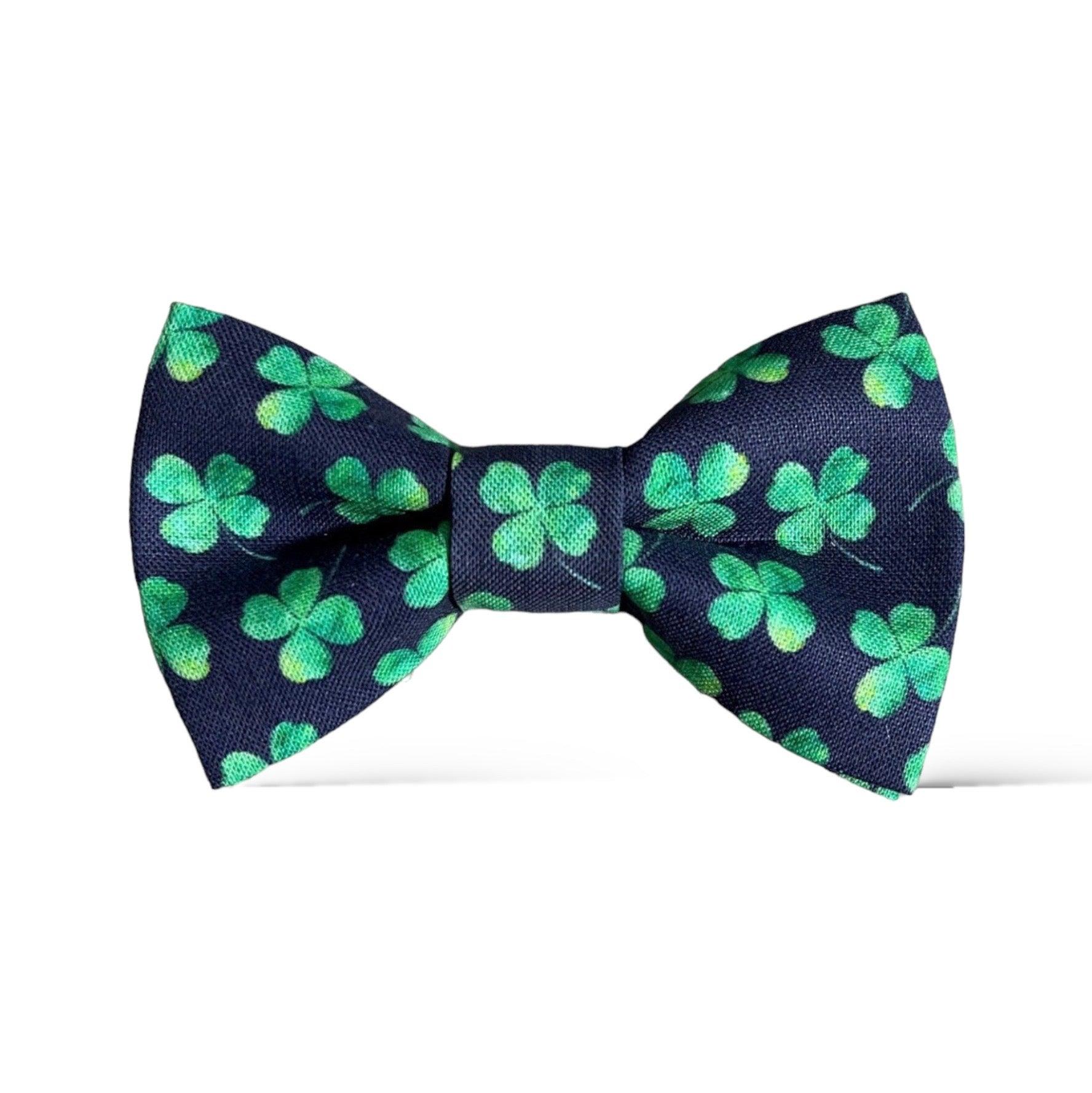 A navy bow tie with a pattern of green shamrocks for St. Patrick’s Day.