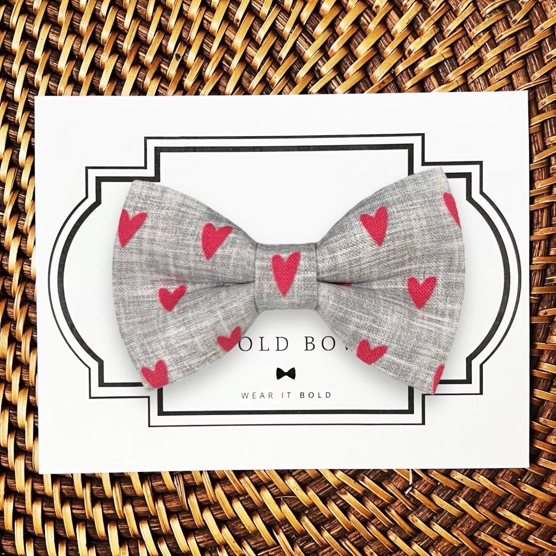 Dog bow tie size chart. Size Small is 3 1/2 inches wide for small dogs under 15 lbs. Size Medium is 4 inches wide for medium dogs between 15 band 40 lbs. Size Large is 4 1/2 inches wide for Large Dogs between 40 band 80 lbs. Size Extra Large is 5 1/2 inches wide for Extra Large Dogs over 80 lbs. Sizing is up to preference and pet bow ties slide on to dog collars with elastic.