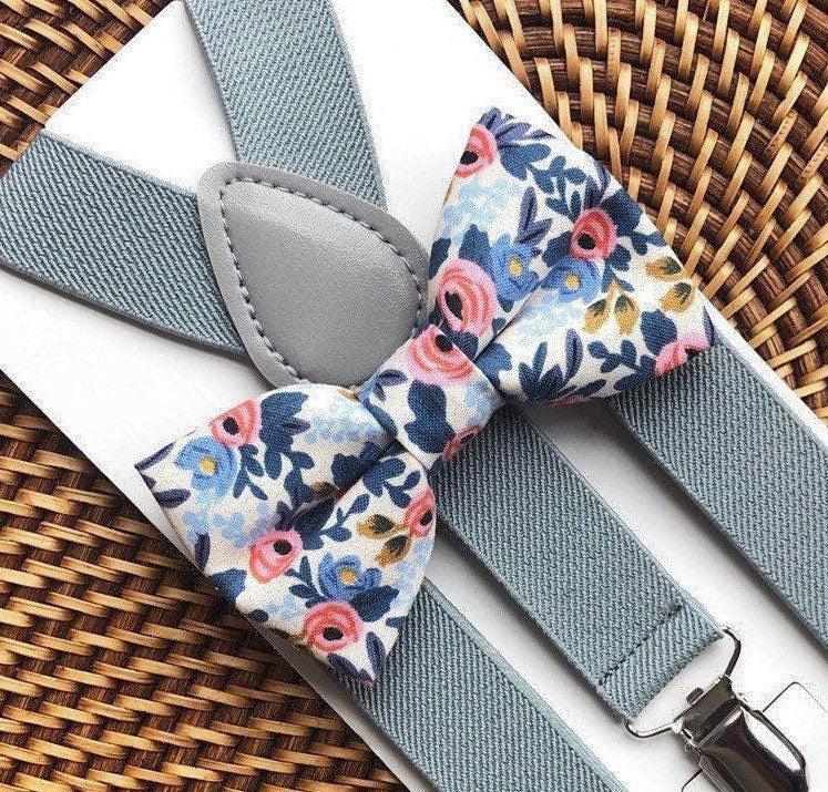 Floral bow tie and suspenders on a woven surface