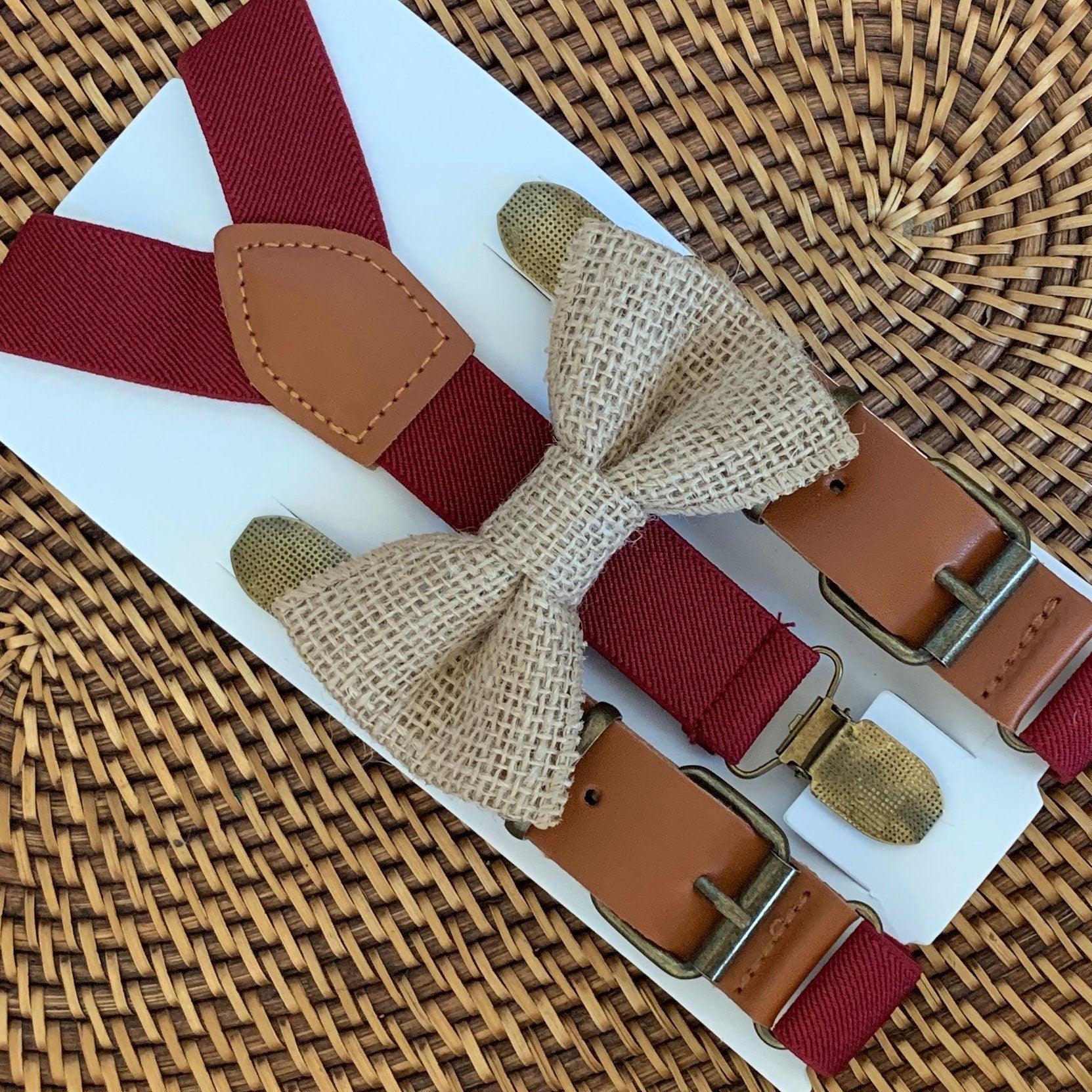A country chic burlap bow tie and rustic burgundy buckle suspenders for men and boys to wear to a cowboy wedding.