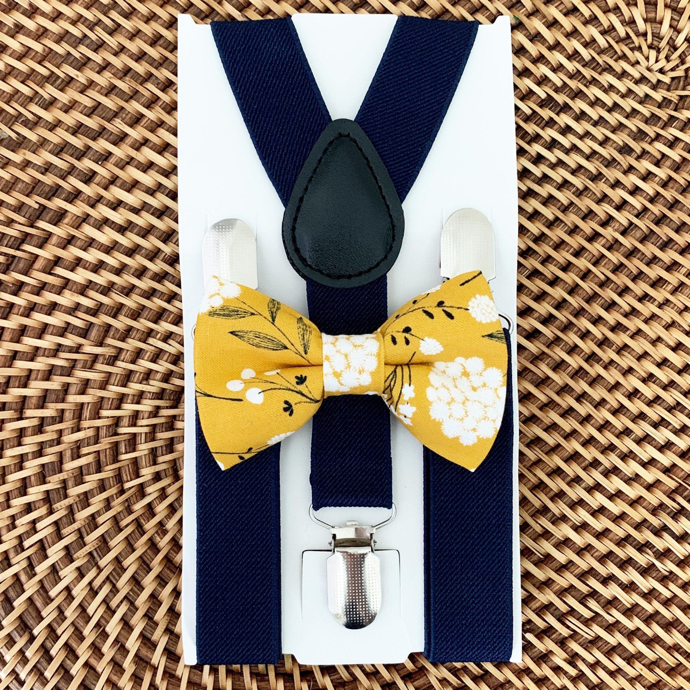 Size chart for suspender and bow tie sets from The Bold Bow Tie. Small (6mo-6yr): 18"-29" suspenders, 3.5" bow. Medium (7-12yr): 25.5"-40" suspenders, 4" bow. Adult (13yr-6ft tall): 25.5"-40" suspenders, 4.5" bow. Big & Tall (Over 6ft tall): 31"-53" suspenders, 4.5" bow. Instructions note to measure from the back waistband over the shoulder to the front waistband for a comfortable fit.