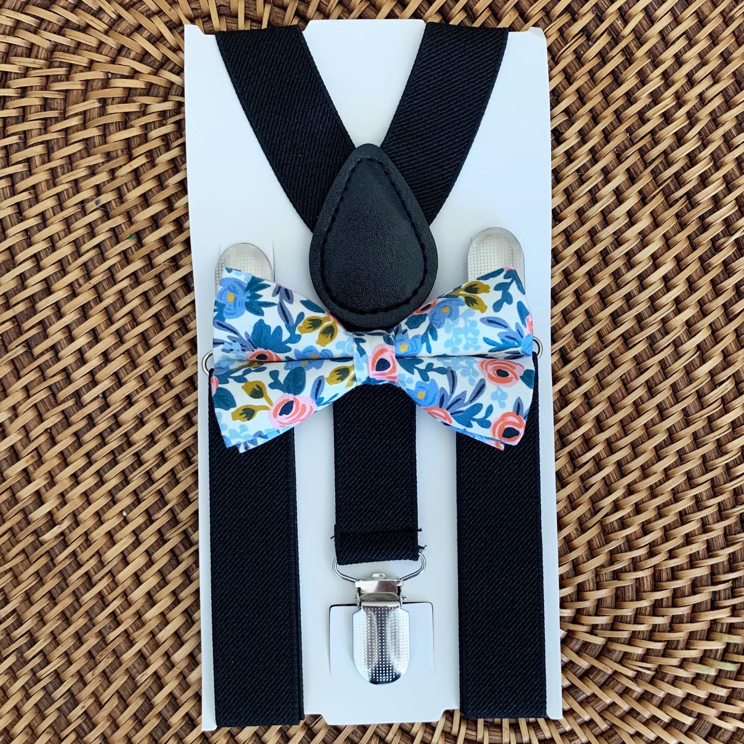 The Bold Bow Tie size chart for bow tie and suspender sets showing Small, Medium, Adult, and Big & Tall sizes with typical age ranges, suspender lengths, and bow tie widths. Small fits ages 6 months–6 years with 18–29 inch suspenders and a 3.5 inch bow tie; Medium fits ages 7–12 years with 25.5–40 inch suspenders and a 4 inch bow tie; Adult fits ages 13 years–6 feet tall with 25.5–40 inch suspenders and a 4.5 inch bow tie; Big & Tall fits over 6 feet tall with 31–53 inch suspenders and a 4.5 inch bow tie.