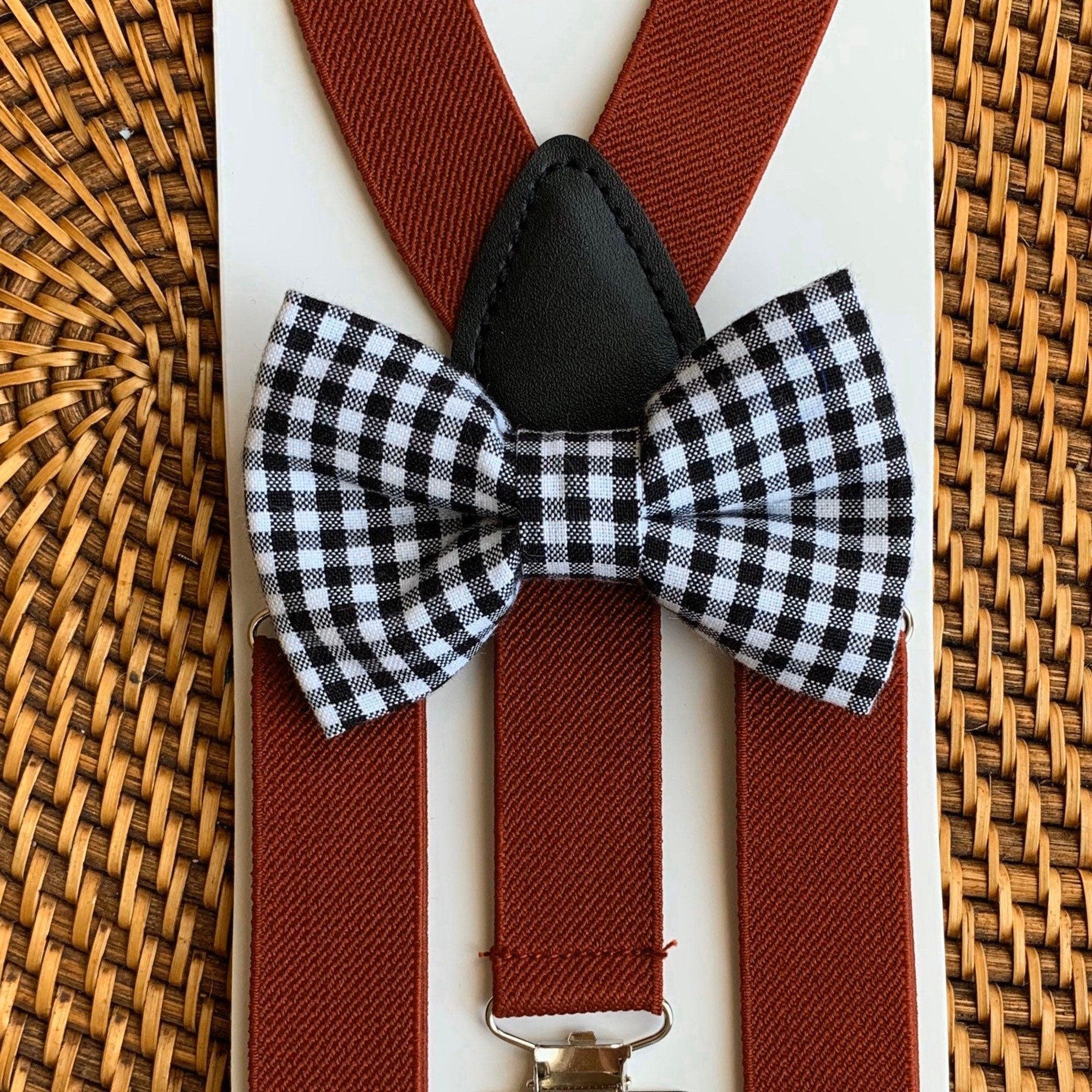 Checkered bow tie and burgundy suspenders.