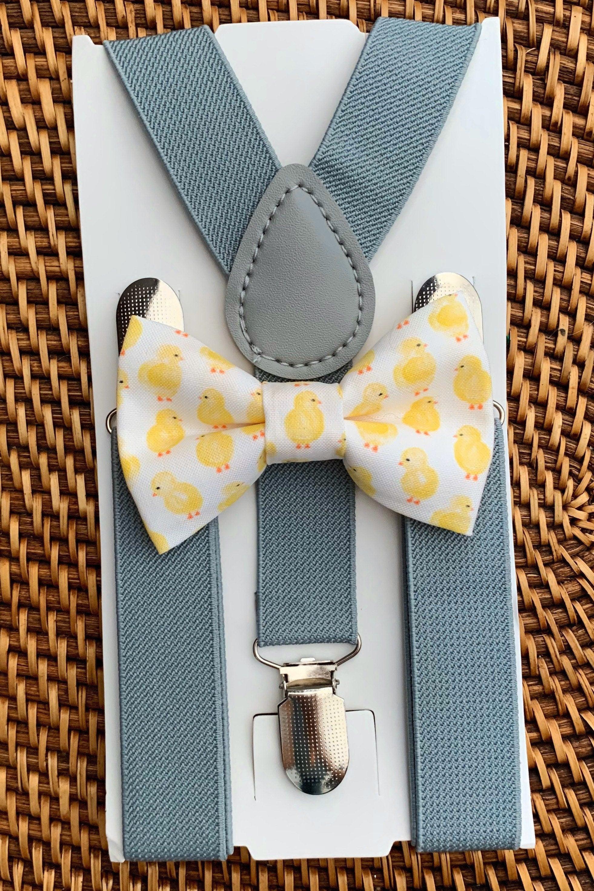 The Bold Bow Tie size chart for bow tie and suspender sets showing Small, Medium, Adult, and Big & Tall sizes with typical age ranges, suspender lengths, and bow tie widths. Small fits ages 6 months–6 years with 18–29 inch suspenders and a 3.5 inch bow tie; Medium fits ages 7–12 years with 25.5–40 inch suspenders and a 4 inch bow tie; Adult fits ages 13 years–6 feet tall with 25.5–40 inch suspenders and a 4.5 inch bow tie; Big & Tall fits over 6 feet tall with 31–53 inch suspenders and a 4.5 inch bow tie.