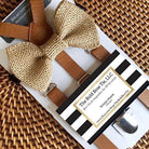 A country chic burlap bow tie and rustic tan suspenders for men and boys to wear to a cowboy wedding.
