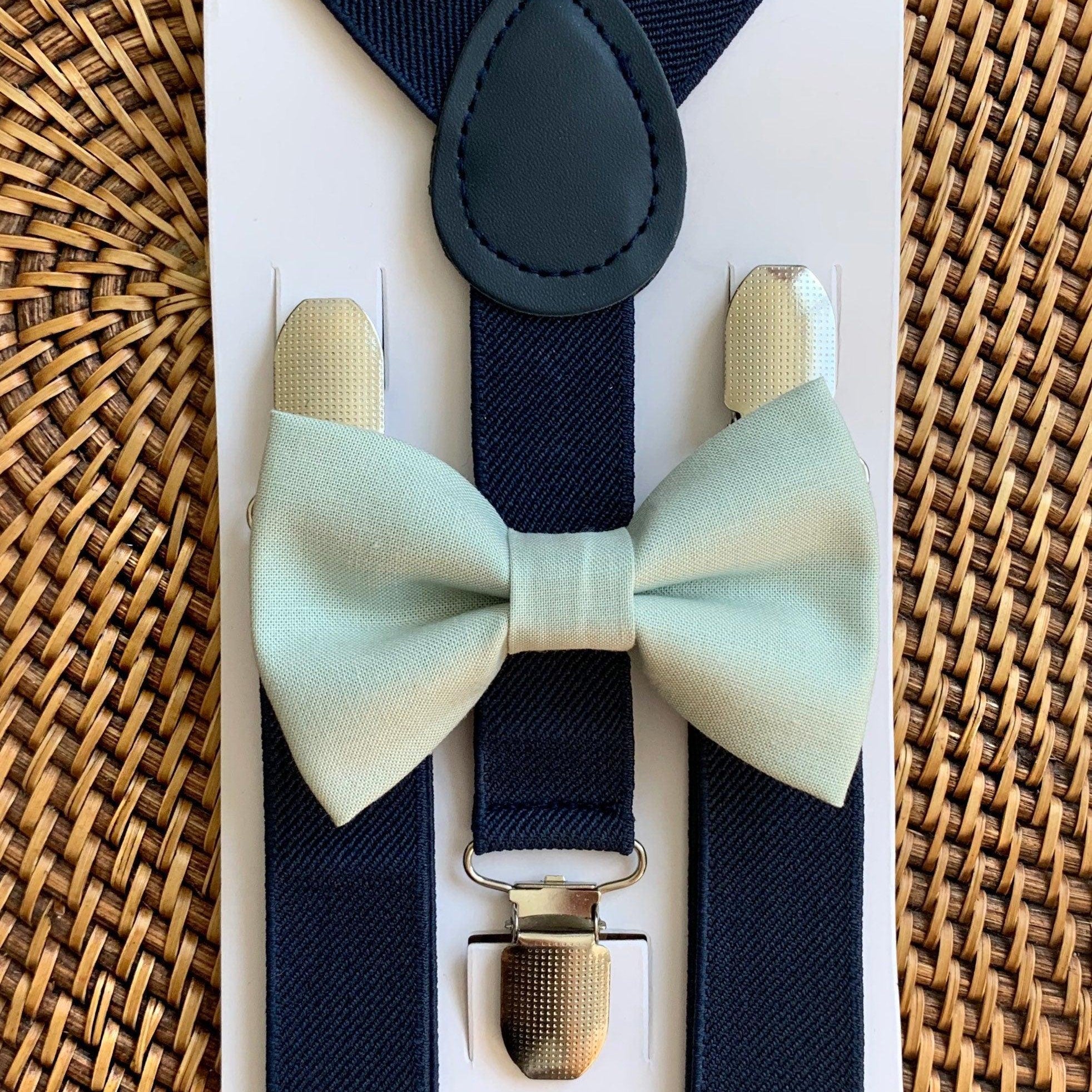 The Bold Bow Tie size chart for bow tie and suspender sets showing Small, Medium, Adult, and Big & Tall sizes with typical age ranges, suspender lengths, and bow tie widths. Small fits ages 6 months–6 years with 18–29 inch suspenders and a 3.5 inch bow tie; Medium fits ages 7–12 years with 25.5–40 inch suspenders and a 4 inch bow tie; Adult fits ages 13 years–6 feet tall with 25.5–40 inch suspenders and a 4.5 inch bow tie; Big & Tall fits over 6 feet tall with 31–53 inch suspenders and a 4.5 inch bow tie.