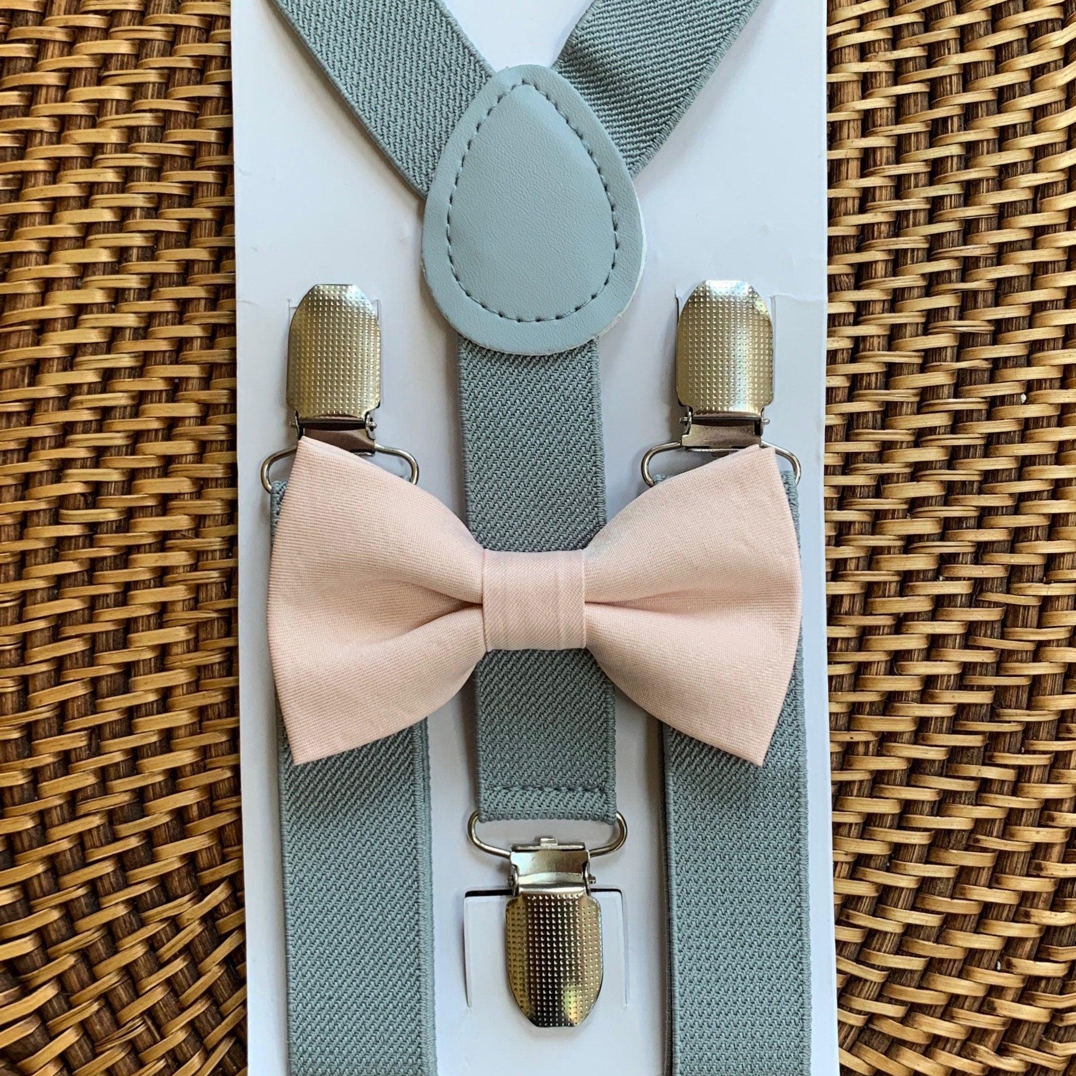 The Bold Bow Tie size chart for bow tie and suspender sets showing Small, Medium, Adult, and Big & Tall sizes with typical age ranges, suspender lengths, and bow tie widths. Small fits ages 6 months–6 years with 18–29 inch suspenders and a 3.5 inch bow tie; Medium fits ages 7–12 years with 25.5–40 inch suspenders and a 4 inch bow tie; Adult fits ages 13 years–6 feet tall with 25.5–40 inch suspenders and a 4.5 inch bow tie; Big & Tall fits over 6 feet tall with 31–53 inch suspenders and a 4.5 inch bow tie.