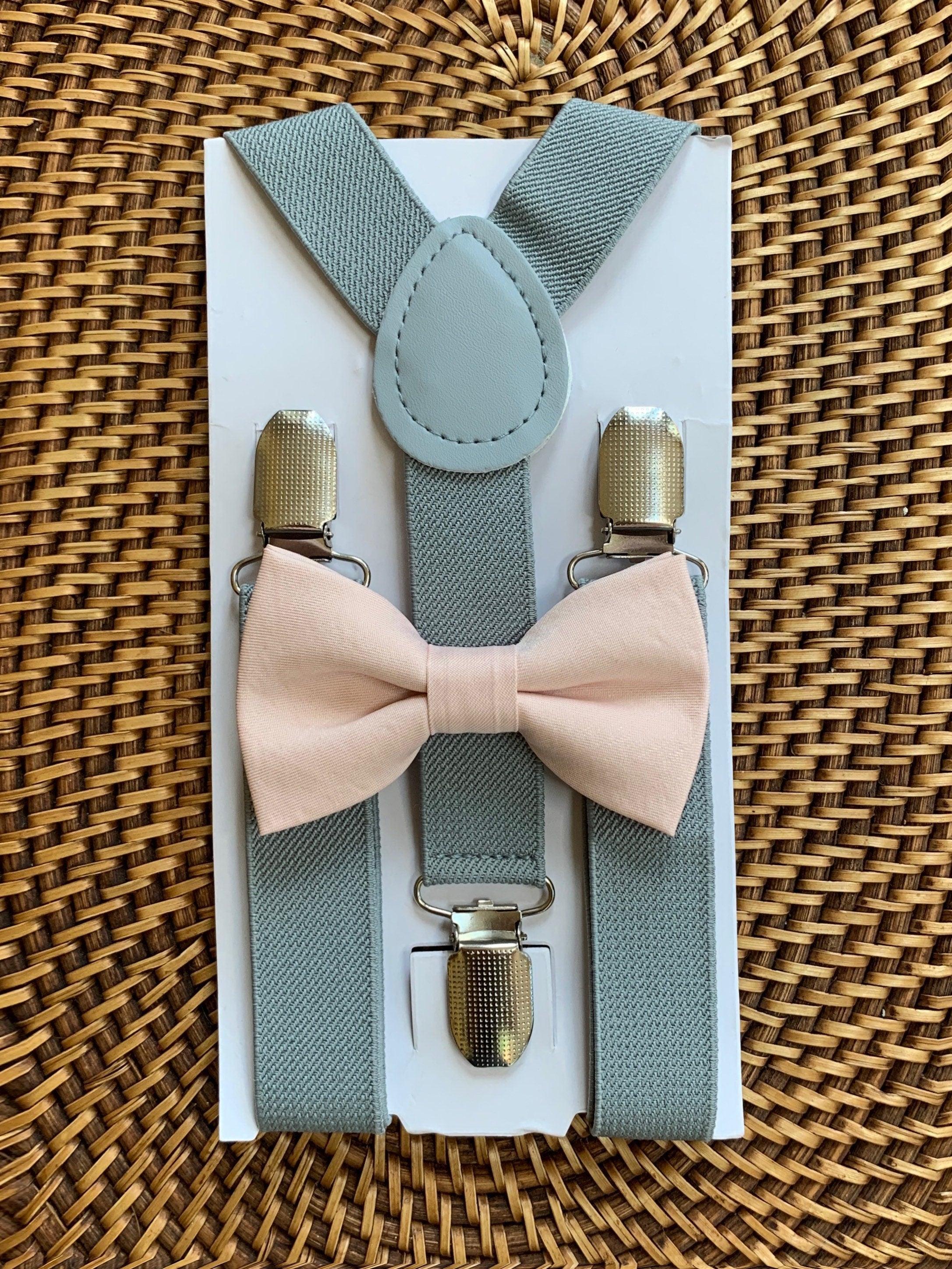 The Bold Bow Tie size chart for bow tie and suspender sets showing Small, Medium, Adult, and Big & Tall sizes with typical age ranges, suspender lengths, and bow tie widths. Small fits ages 6 months–6 years with 18–29 inch suspenders and a 3.5 inch bow tie; Medium fits ages 7–12 years with 25.5–40 inch suspenders and a 4 inch bow tie; Adult fits ages 13 years–6 feet tall with 25.5–40 inch suspenders and a 4.5 inch bow tie; Big & Tall fits over 6 feet tall with 31–53 inch suspenders and a 4.5 inch bow tie.