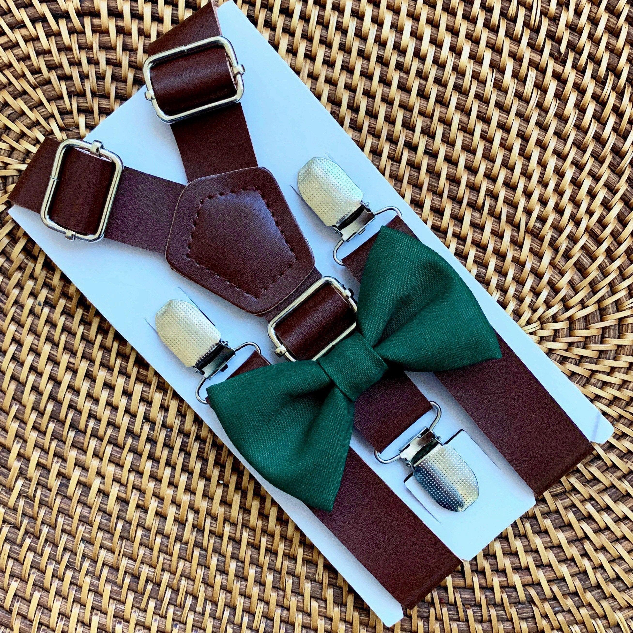 Juniper green bow tie with dark brown vegan leather suspenders on a product card.