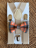 Orange and black plaid bow tie and tan suspenders.