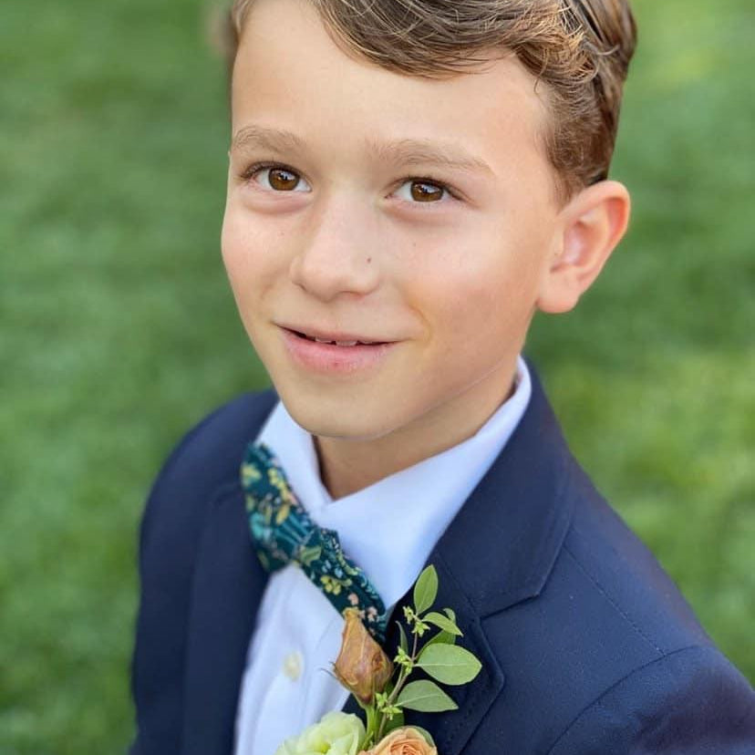 Ring bearer in navy blue bowtie