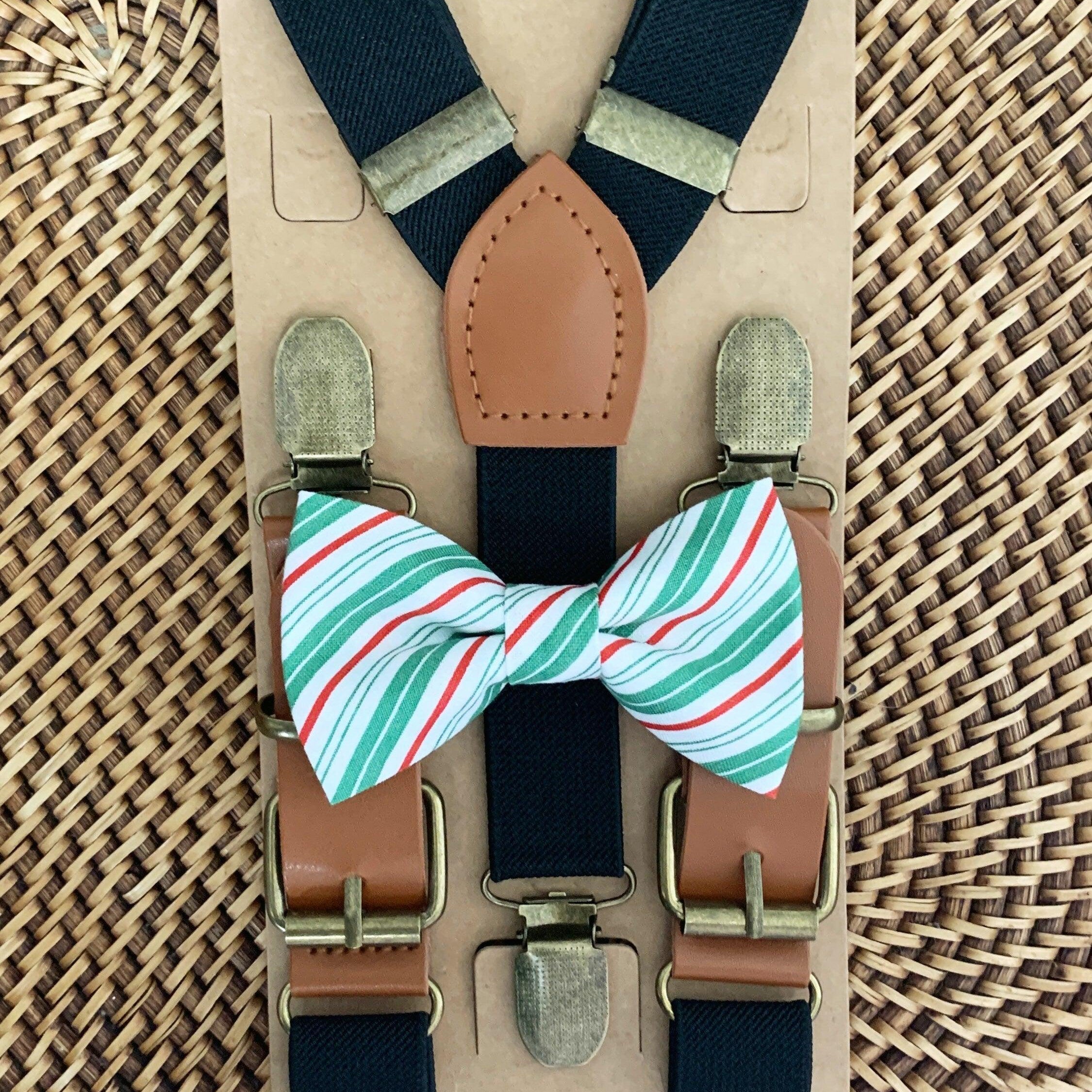 Size chart for suspender and bow tie sets from The Bold Bow Tie. X-Small (6mo-4yr): 15"-23" suspenders, 3.5" bow. Small (5-9yr): 18"-33" suspenders, 3.5" bow. Medium (10-12yr): 18"-33" suspenders, 4" bow. Adult (13yr-6'5"): 30"-53" suspenders, 4.5" bow. Big & Tall (Over 6'5"): 53"+ suspenders, 4.5" bow. Instructions note to measure from the back waistband over the shoulder to the front waistband for a comfortable fit.